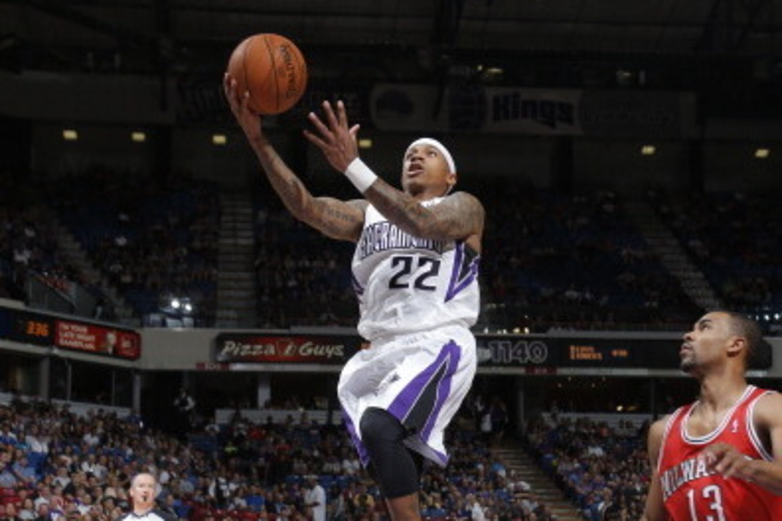SACRAMENTO, CA - MARCH 23:  Isaiah Thomas #22 of the Sacramento Kings goes up for a shot against the Milwaukee Bucks at Sleep Train Arena on March 23, 2014 in Sacramento, California. NOTE TO USER: User expressly acknowledges and agrees that, by downloadin
