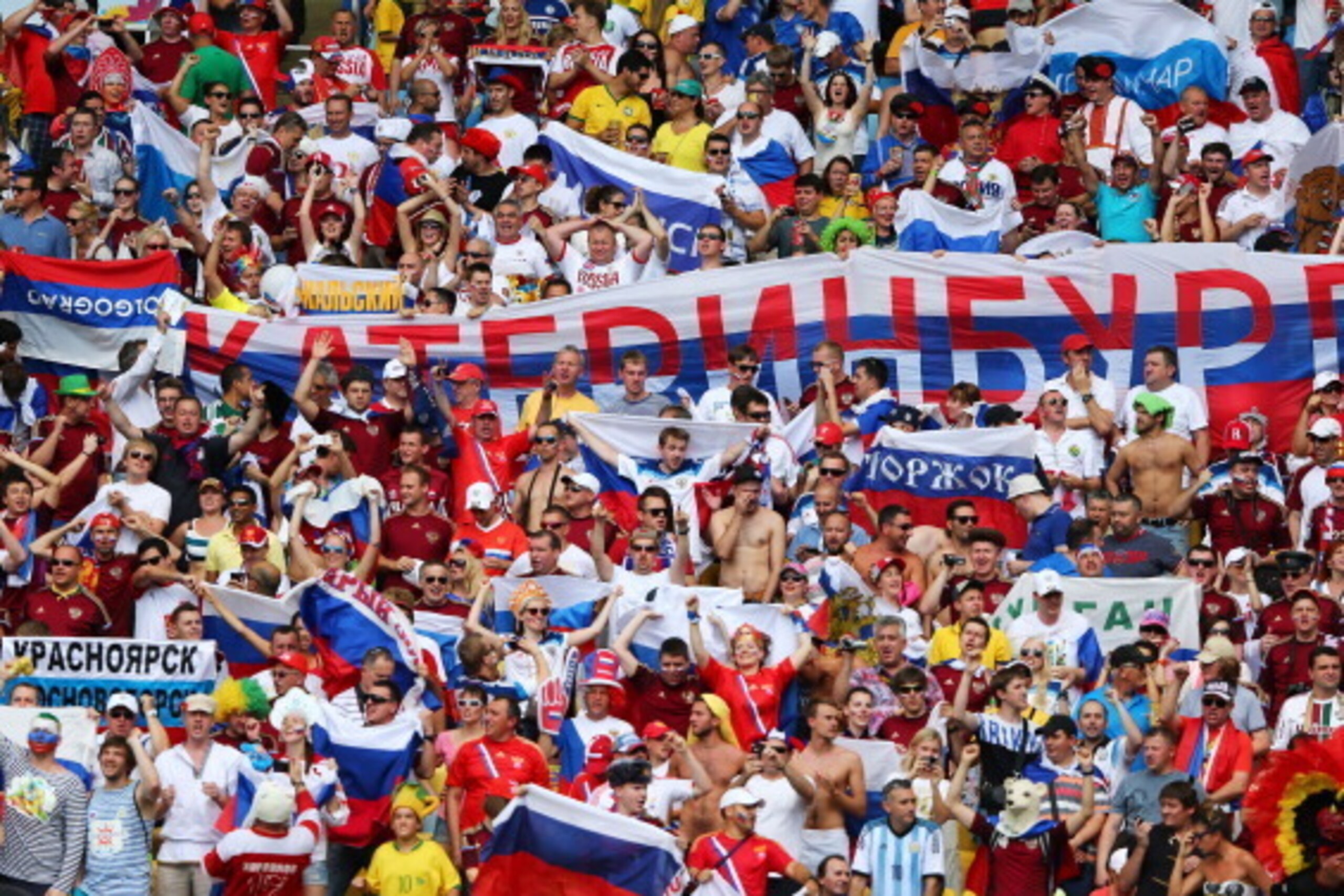 RIO DE JANEIRO, BRAZIL - JUNE 22:  Russia fans cheer during the 2014 FIFA World Cup Brazil Group H match between Belgium and Russia at Maracana on June 22, 2014 in Rio de Janeiro, Brazil.  (Photo by Jamie Squire/Getty Images)
