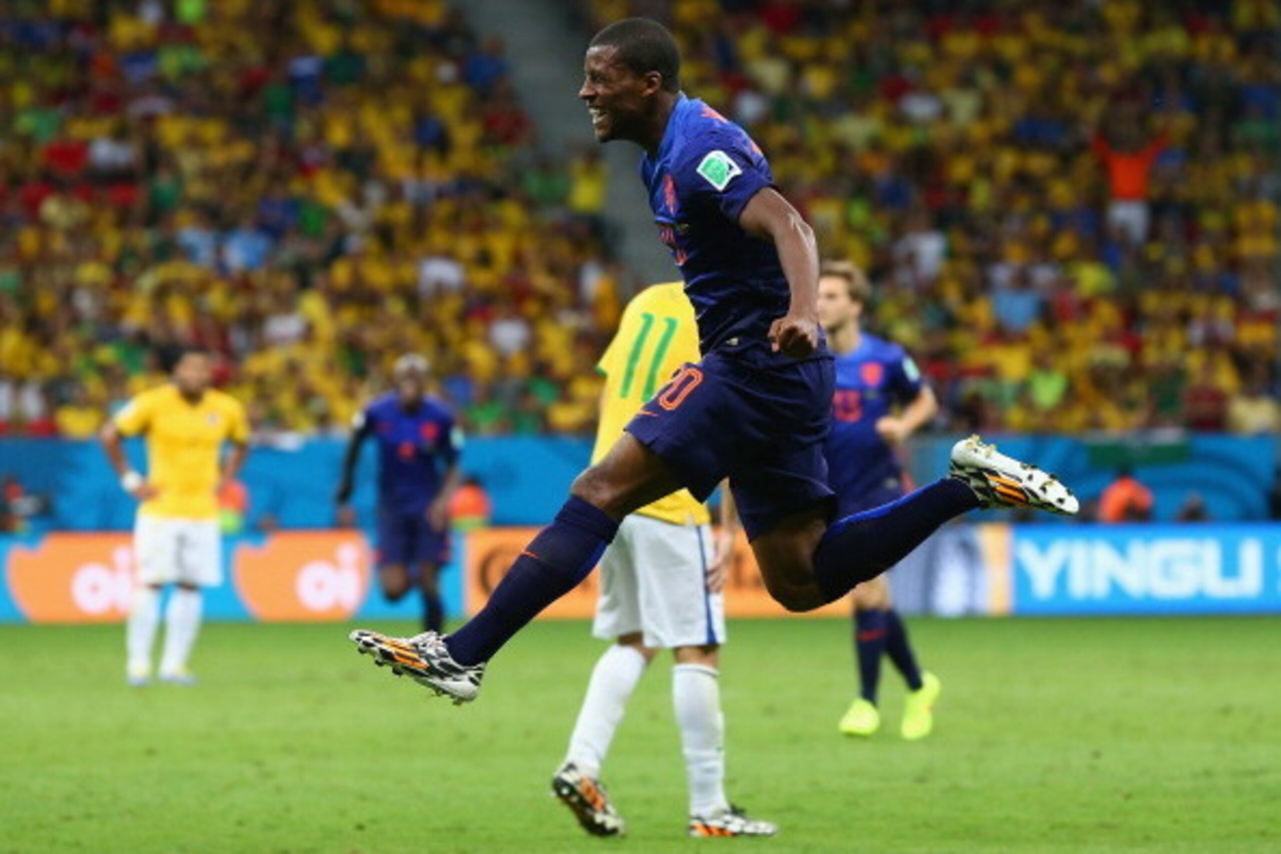 BRASILIA, BRAZIL - JULY 12:  Georginio Wijnaldum of the Netherlands celebrates scoring his team's third goal during the 2014 FIFA World Cup Brazil Third Place Playoff match between Brazil and the Netherlands at Estadio Nacional on July 12, 2014 in Brasili