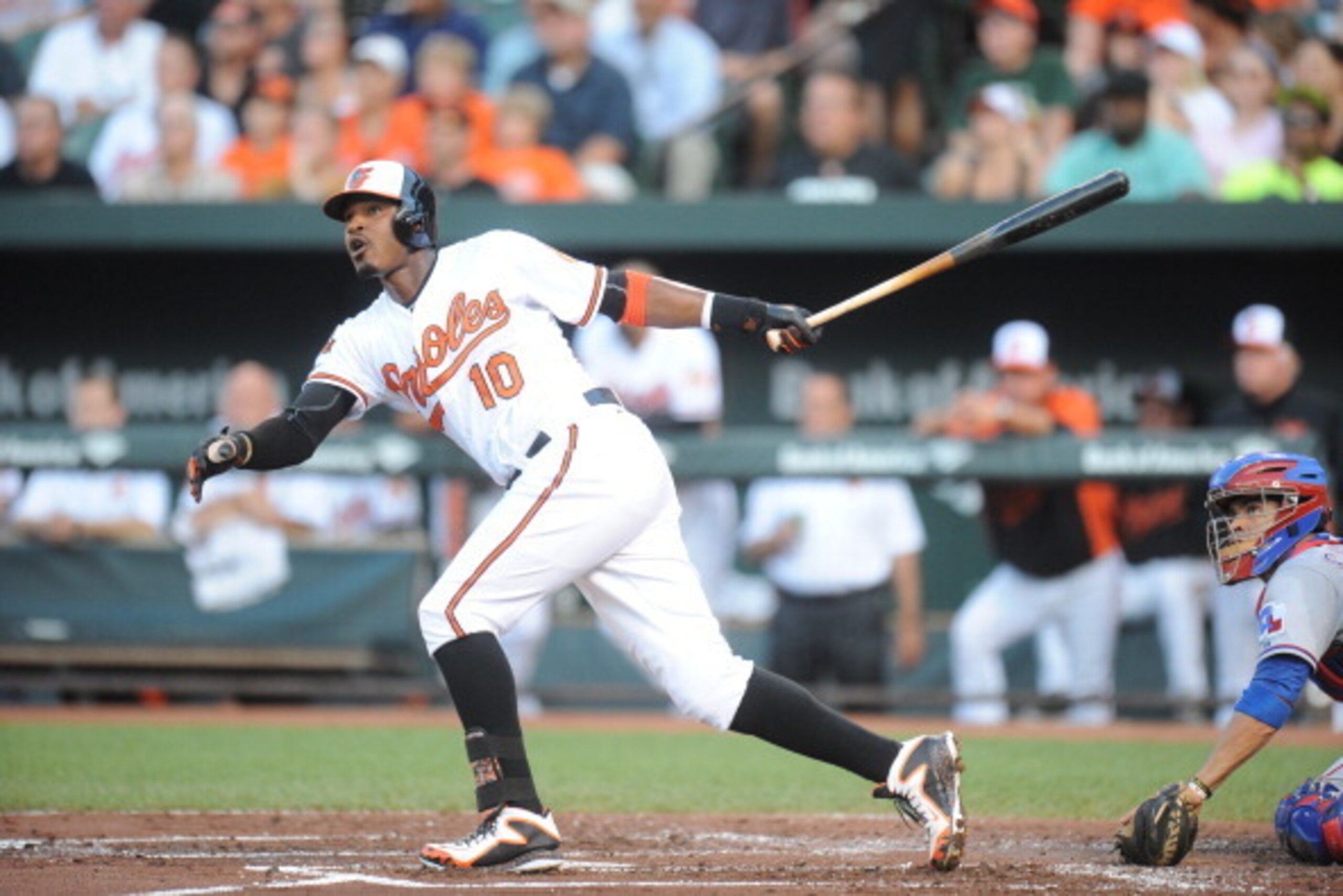 BALTIMORE, MD - JUNE 30:  Adam Jones #10 of the Baltimore Orioles hits a solo home run in the first inning during a baseball game against the Baltimore Orioles on June 30, 2014 at Oriole Park at Camden Yards in Baltimore, Maryland.  (Photo by Mitchell Lay