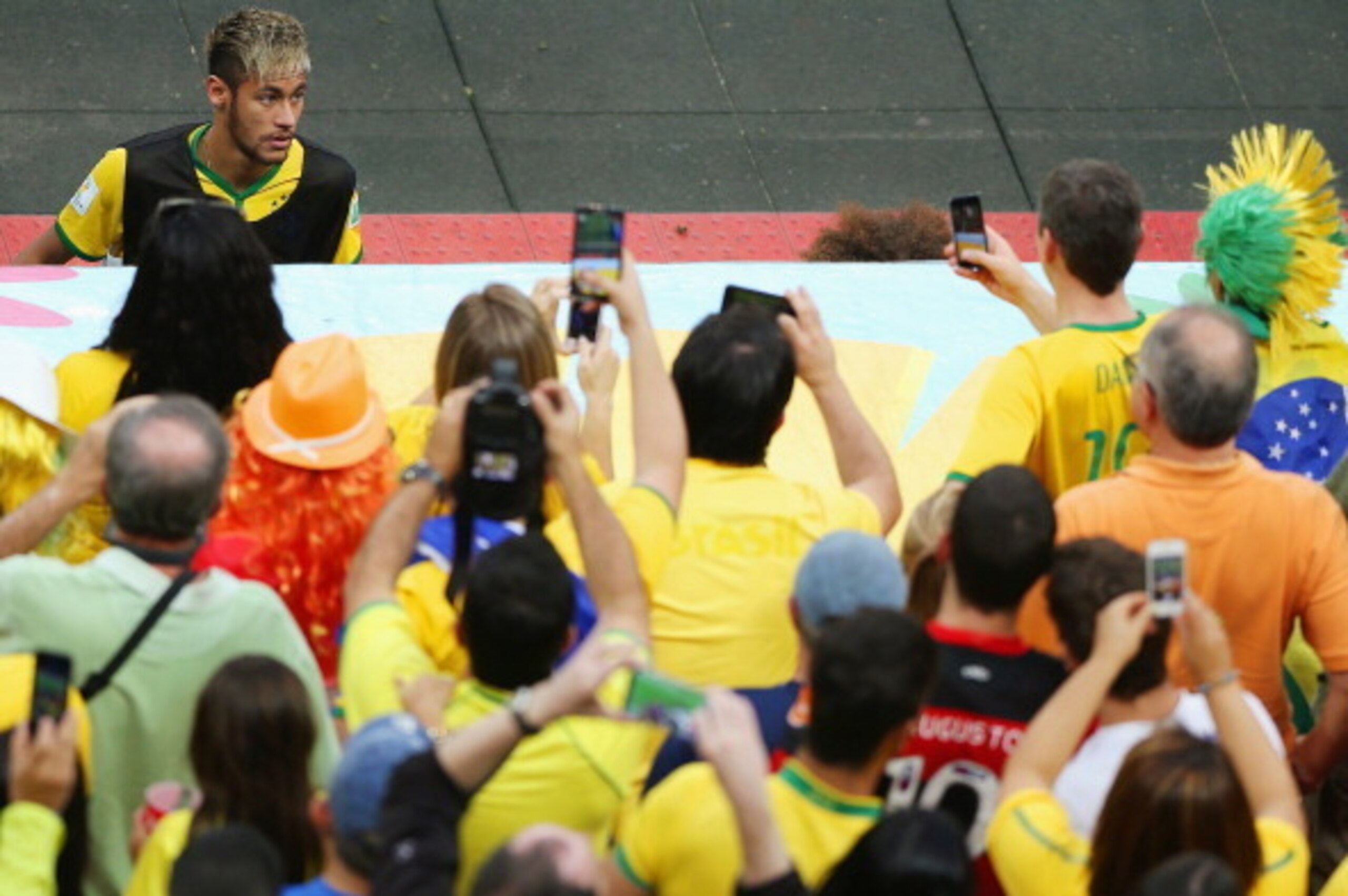 BRASILIA, BRAZIL - JULY 12: Neymar of Brazil looks up to the crowd during the 2014 FIFA World Cup Brazil Third Place Playoff match between Brazil and the Netherlands at Estadio Nacional on July 12, 2014 in Brasilia, Brazil.  (Photo by Celso Junior/Getty I