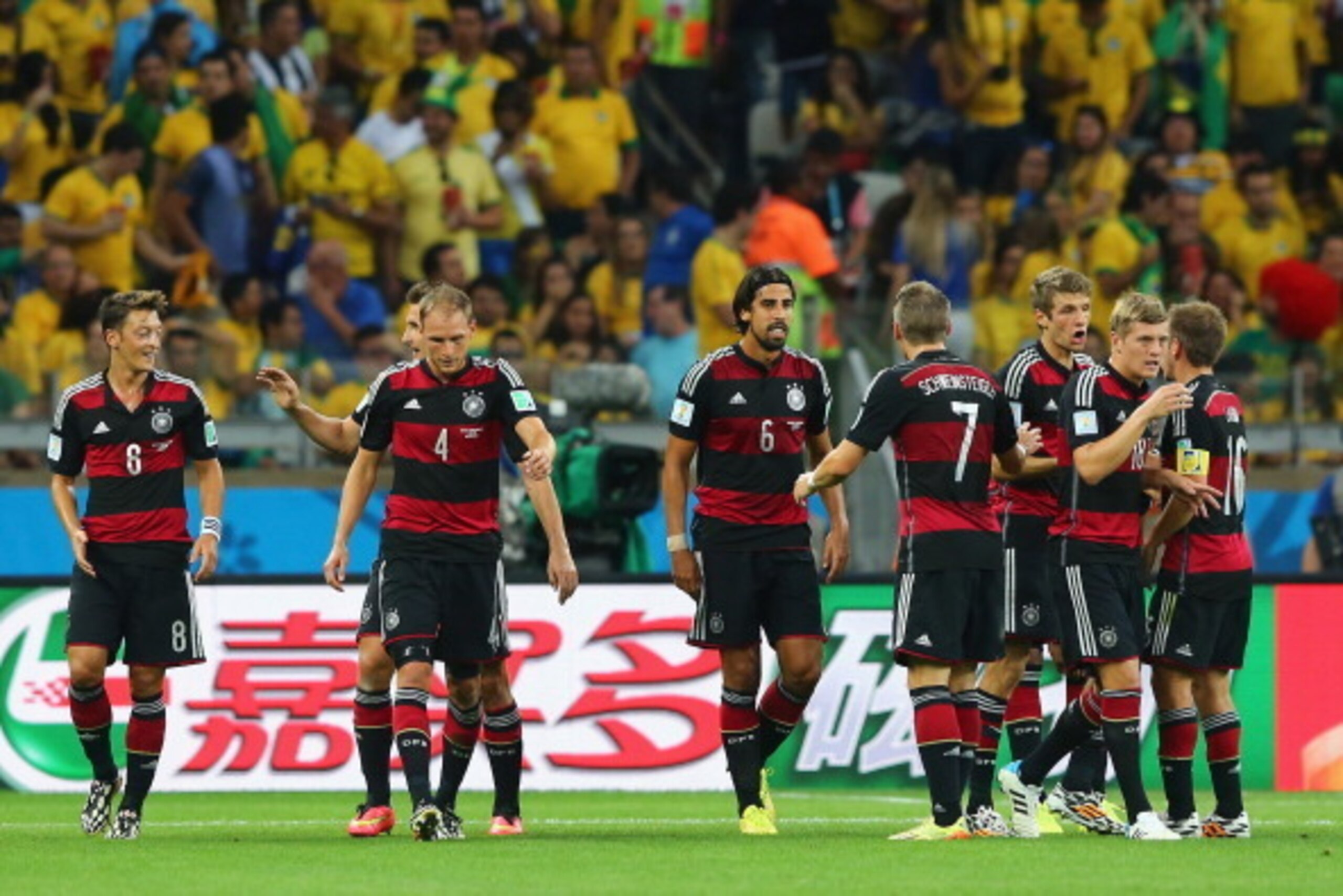 BELO HORIZONTE, BRAZIL - JULY 08:  Sami Khedira of Germany (C) celebrates with his team-mates (L-R)  Mesut Oezil, Miroslav Klose, Benedikt Hoewedes, Bastian Schweinsteiger, Thomas Mueller, Toni Kroos of Germany and Philipp Lahm after scoring their fifth g