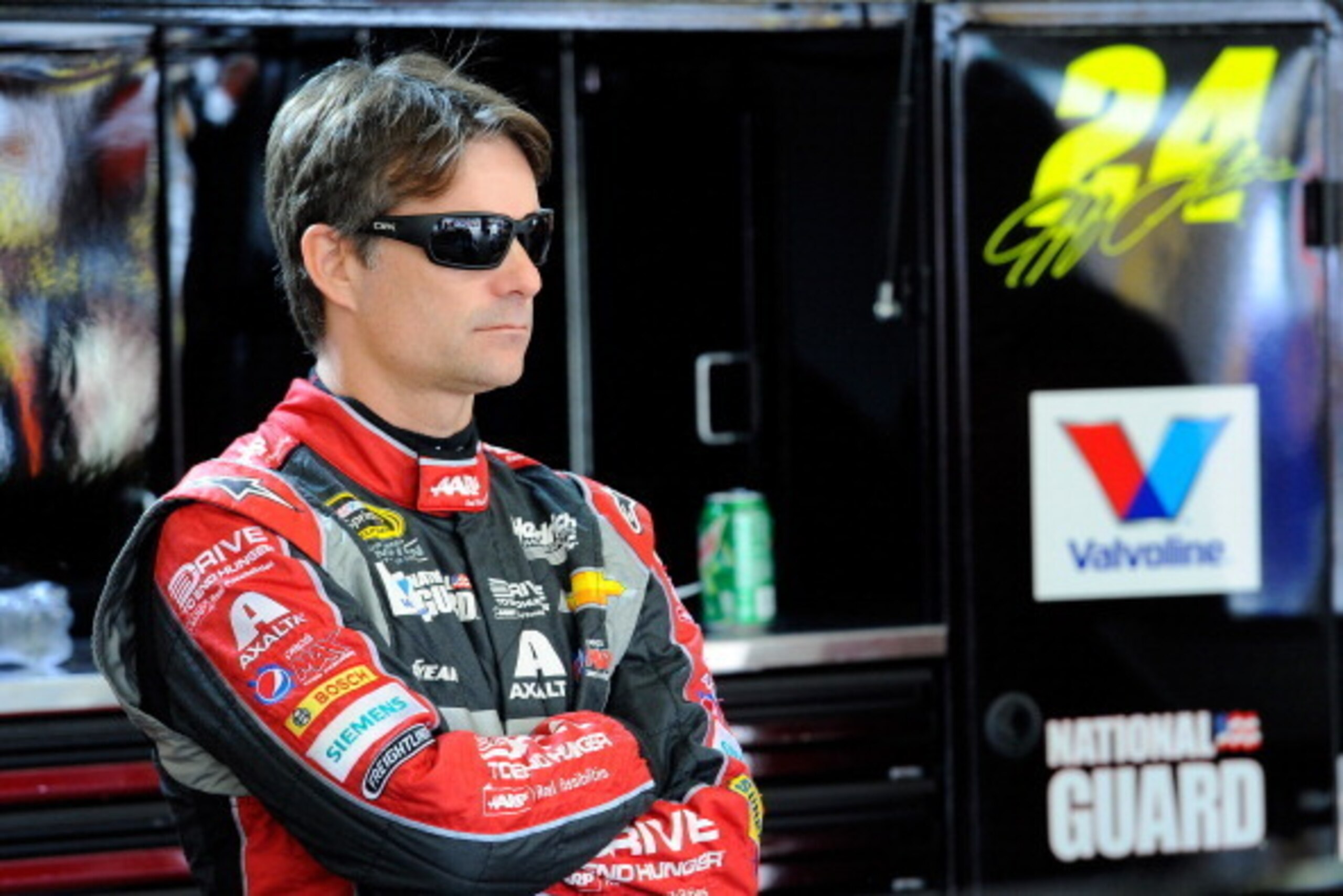 LOUDON, NH - JULY 11:  Jeff Gordon, driver of the #24 Drive to End Hunger Chevrolet, looks on in the garage area during practice for the NASCAR Sprint Cup Series Camping World RV Sales 301 at New Hampshire Motor Speedway on July 11, 2014 in Loudon, New Ha