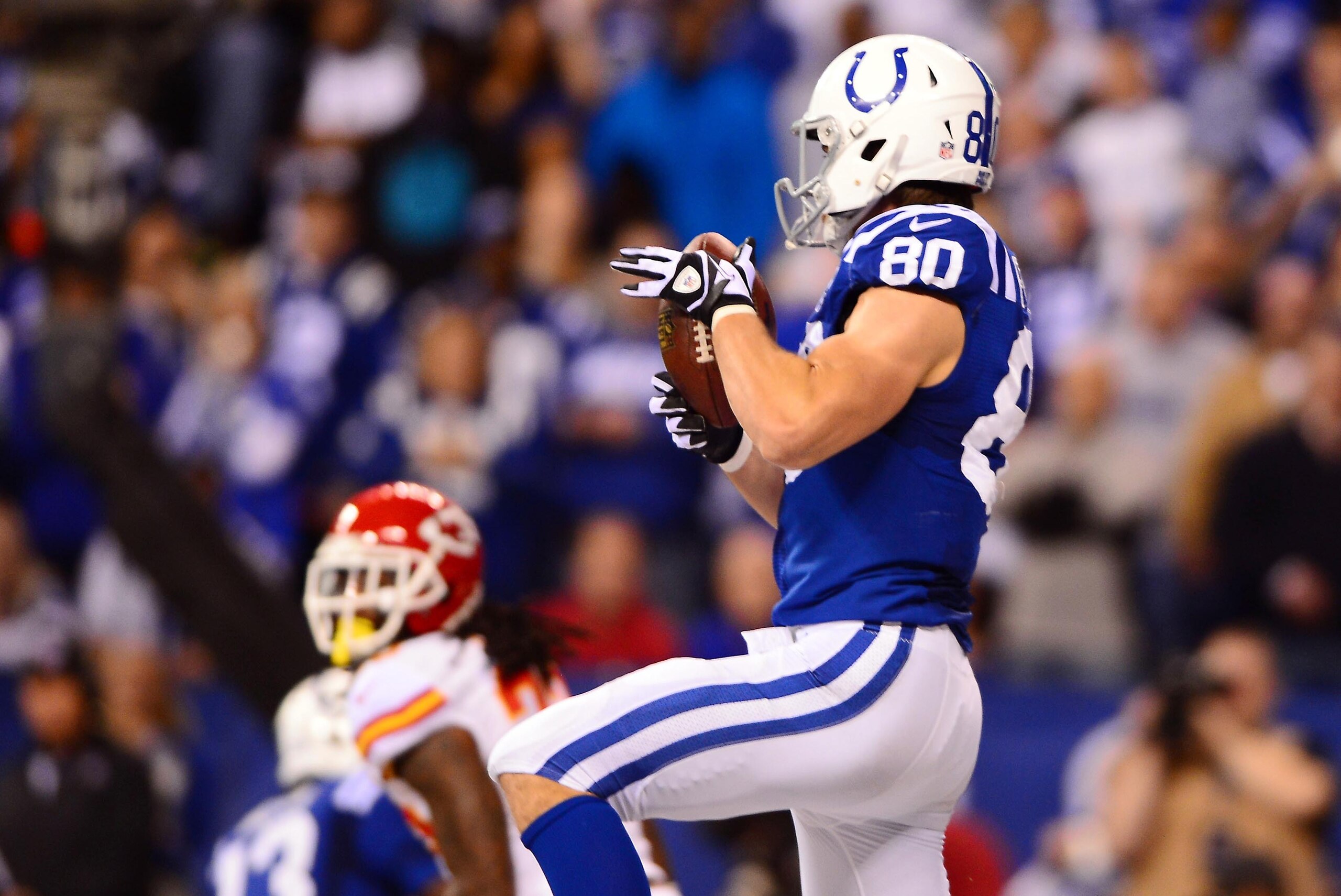 Jan 4, 2014; Indianapolis, IN, USA; Indianapolis Colts tight end Coby Fleener (80) catches a pass in the end zone for a touchdown during the third quarter of the 2013 AFC wild card playoff football game against the Kansas City Chiefs at Lucas Oil Stadium.