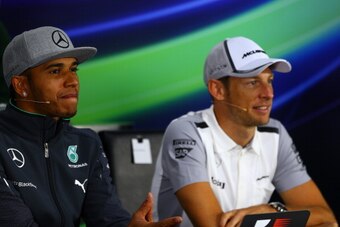MONTREAL, QC - JUNE 05:  Lewis Hamilton of Great Britain and Mercedes GP and Jenson Button of Great Britain and McLaren attend a press conference ahead of the Canadian Formula One Grand Prix at Circuit Gilles Villeneuve on June 5, 2014 in Montreal, Canada