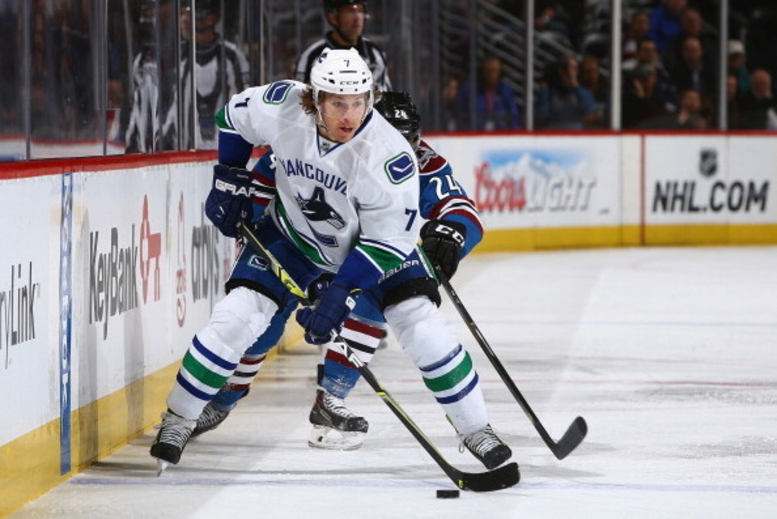 DENVER, CO - MARCH 27:  David Booth #7 of the Vancouver Canucks controls the puck against Marc-Andre Cliche #24 of the Colorado Avalanche at Pepsi Center on March 27, 2014 in Denver, Colorado.  (Photo by Doug Pensinger/Getty Images)