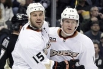 Nov 18, 2013; Pittsburgh, PA, USA; Anaheim Ducks center Ryan Getzlaf (15) celebrates after scoring a goal with right wing Corey Perry (10) against the Pittsburgh Penguins during the third period at the CONSOL Energy Center. The Penguins won 3-1. Mandatory