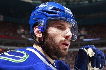 VANCOUVER, BC - APRIL 7:  Ryan Kesler #17 of the Vancouver Canucks looks on from the bench during their NHL game against the Anaheim Ducks at Rogers Arena April 7, 2014 in Vancouver, British Columbia, Canada.  Anaheim won 3-0 to eliminate the Canucks from