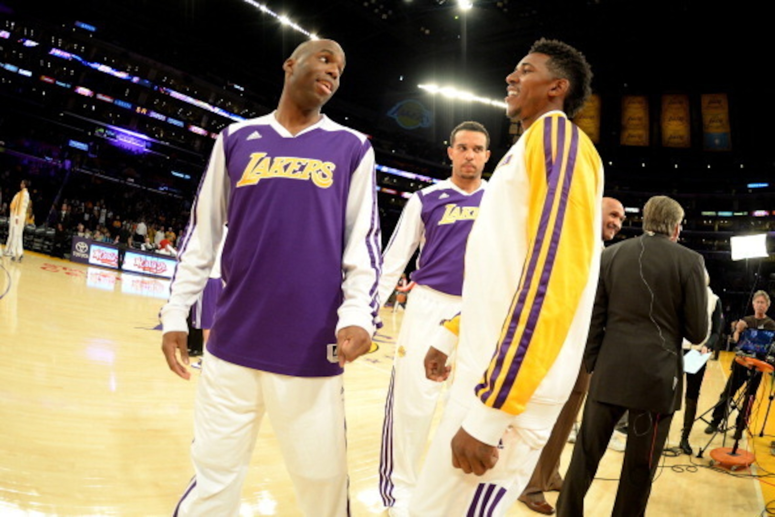 LOS ANGELES, CA - NOVEMBER 3: Jodie Meeks #20 and Nick Young #0 of the Los Angeles Lakers converse before a game against the Atlanta Hawks on November 3, 2013 at STAPLES Center in Los Angeles, California. NOTE TO USER: User expressly acknowledges and agre