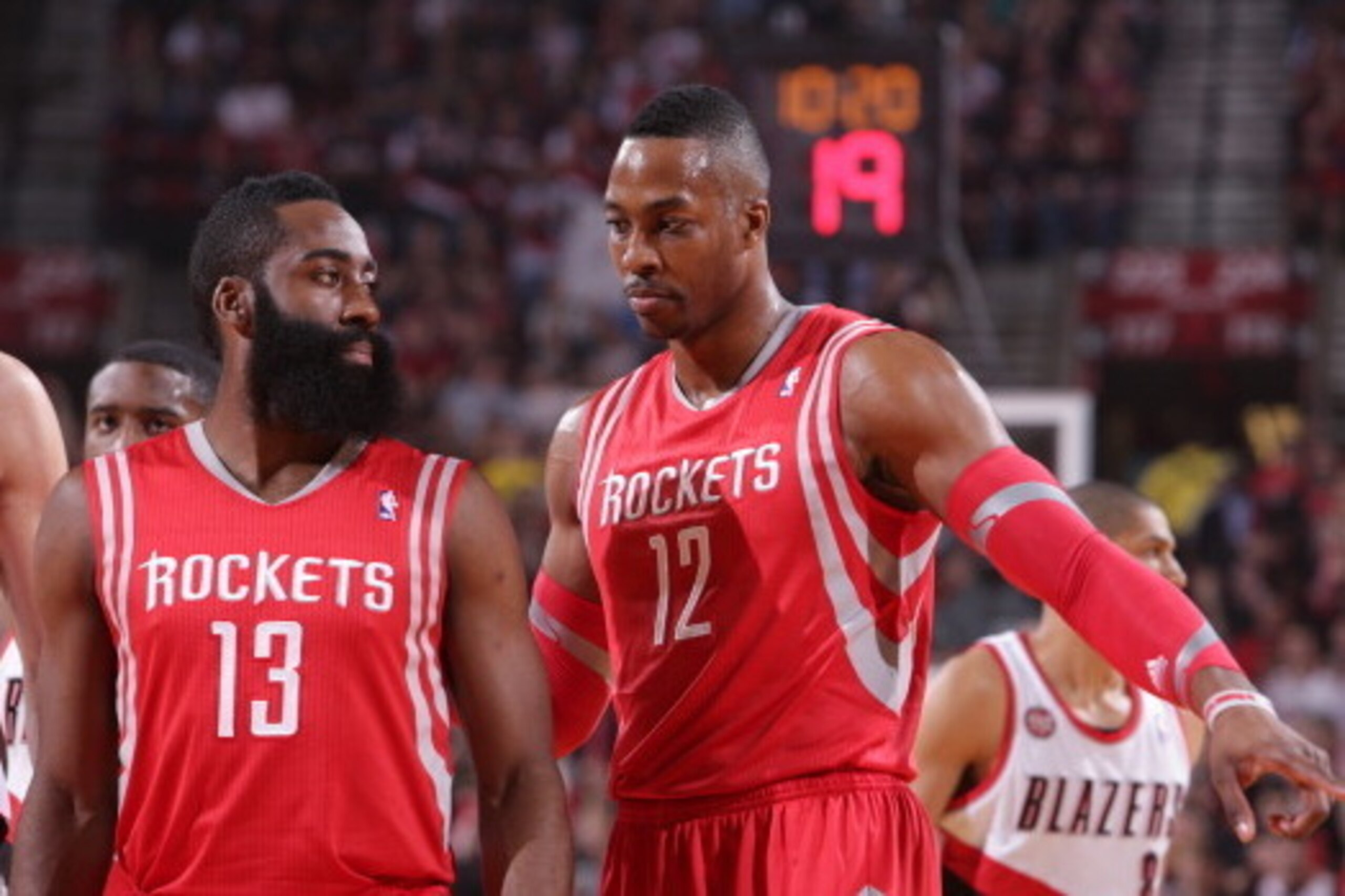 PORTLAND, OR - MAY 2:  James Harden #13 and Dwight Howard #12 of the Houston Rockets walk up court in Game Six of the Western Conference Quarterfinals against the Portland Trail Blazers during the 2014 NBA Playoffs on May 2, 2014 at the Moda Center in Por