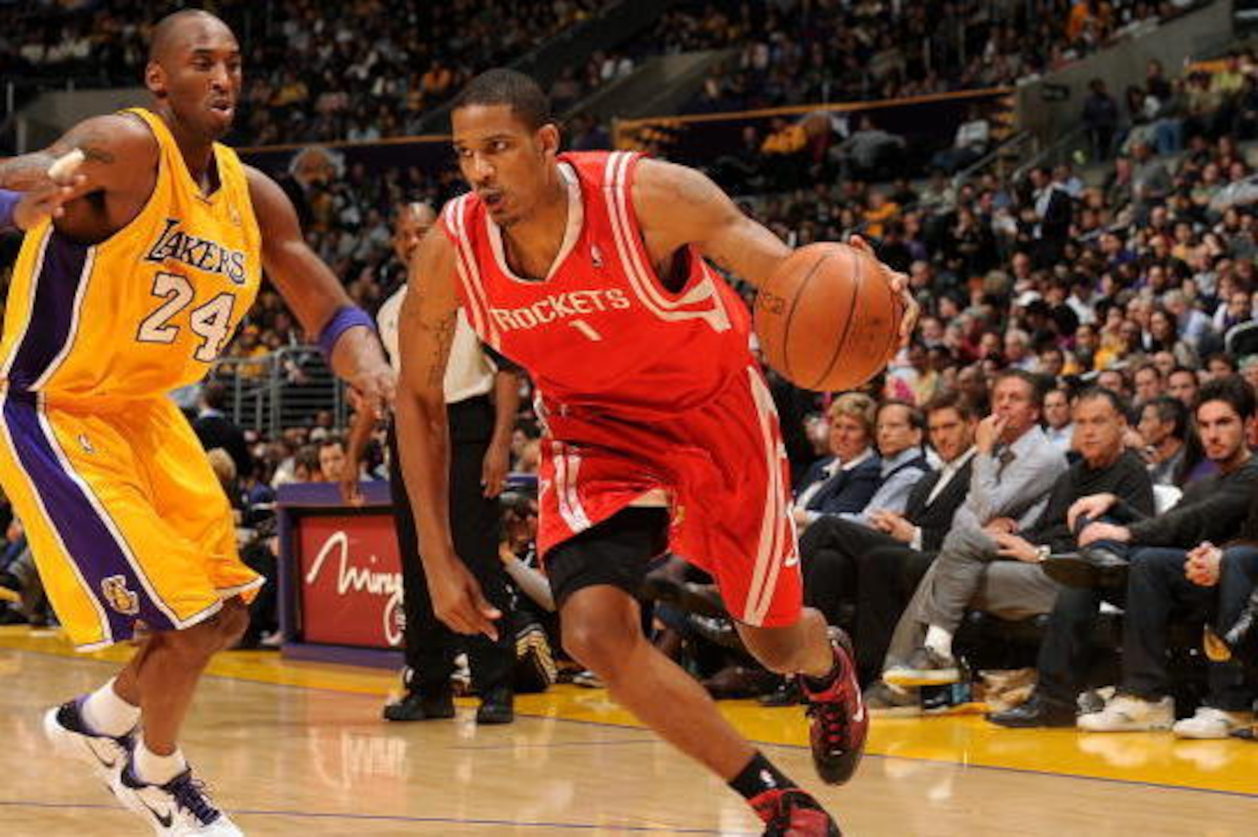 LOS ANGELES - JANUARY 05:  Trevor Ariza #1 of the Houston Rockets drives the ball around Kobe Bryant #24 of the Los Angeles Lakers during the game on January 5, 2010 at Staples Center in Los Angeles, California.  The Lakers won 88-79.  NOTE TO USER: User