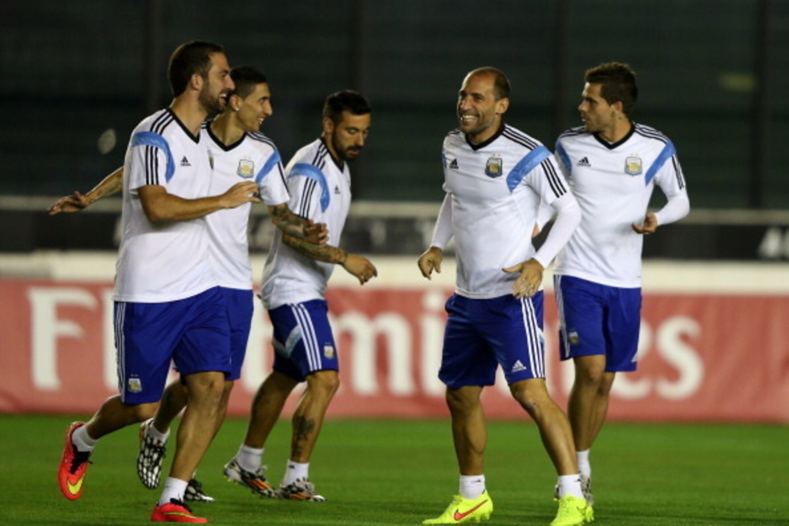 RIO DE JANEIRO, BRAZIL - JULY 12:  Pablo Zabaleta (2nd R) of Germany shares a joke with teammates during the Argentina training session, ahead of the 2014 FIFA World Cup Final, at Estadio Sao Januario on July 12, 2014 in Rio de Janeiro, Brazil.  (Photo by