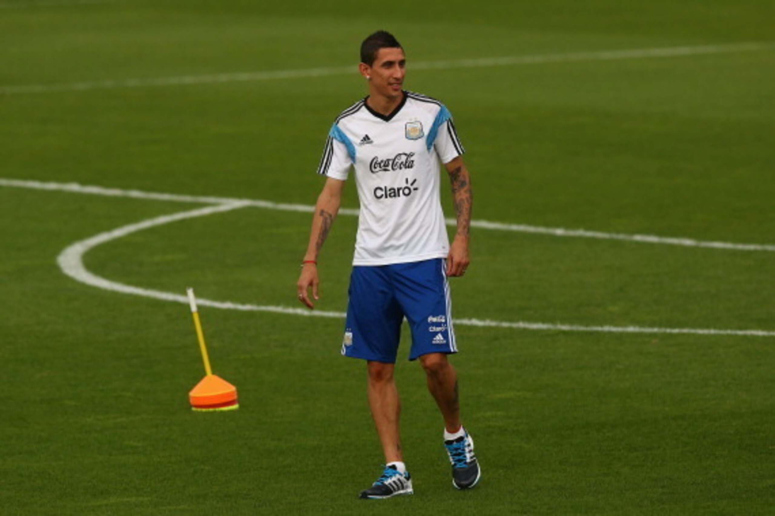 VESPASIANO, BRAZIL - JULY 02:  Angel di Maria of Argentina warms up during a training session on July 2, 2014 in Vespasiano, Brazil.  (Photo by Ronald Martinez/Getty Images)