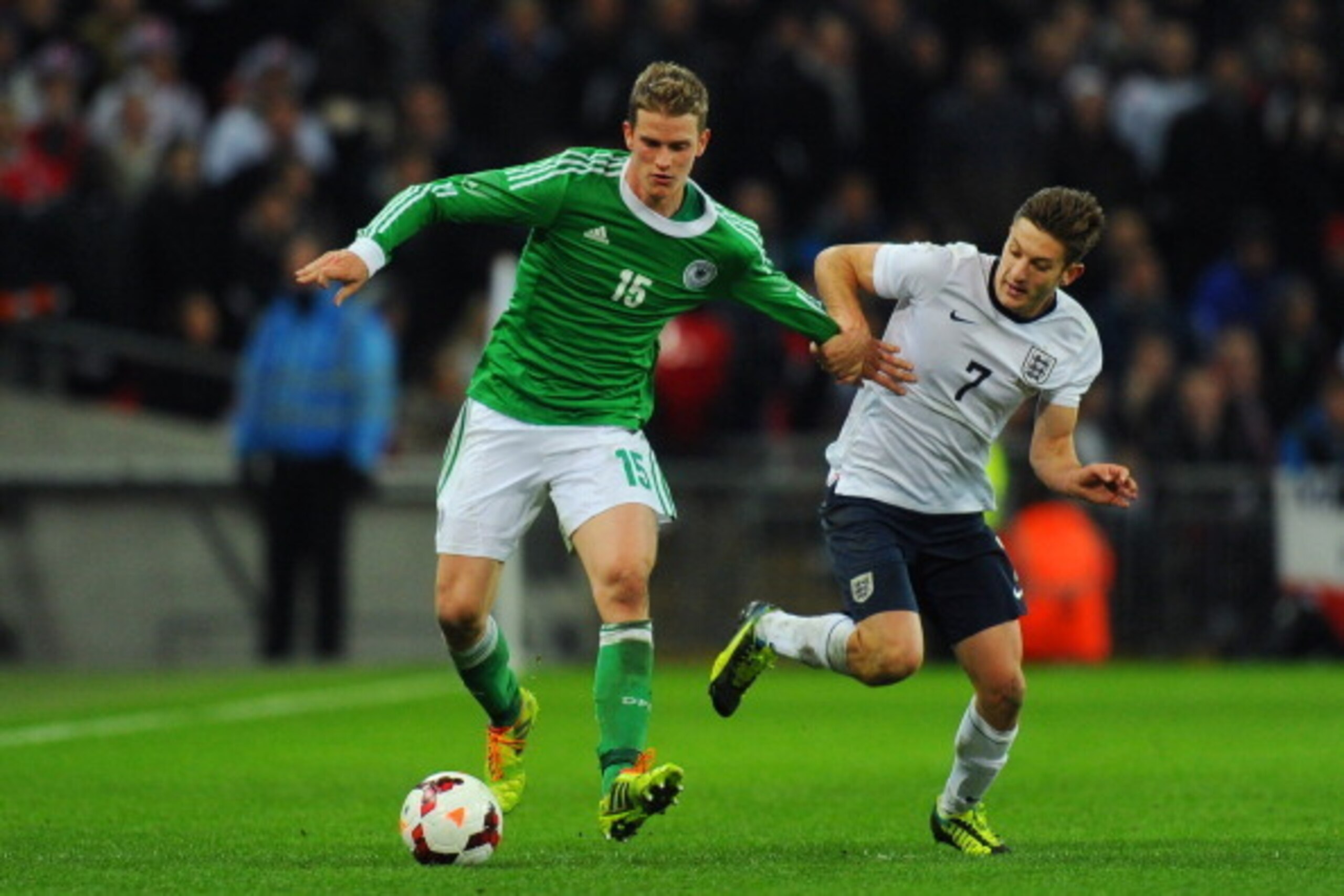 LONDON, ENGLAND - NOVEMBER 19:  Lars Bender of Germany battles with Adam Lallana of England during the international friendly match between England and Germany at Wembley Stadium on November 19, 2013 in London, England.  (Photo by Mike Hewitt/Getty Images