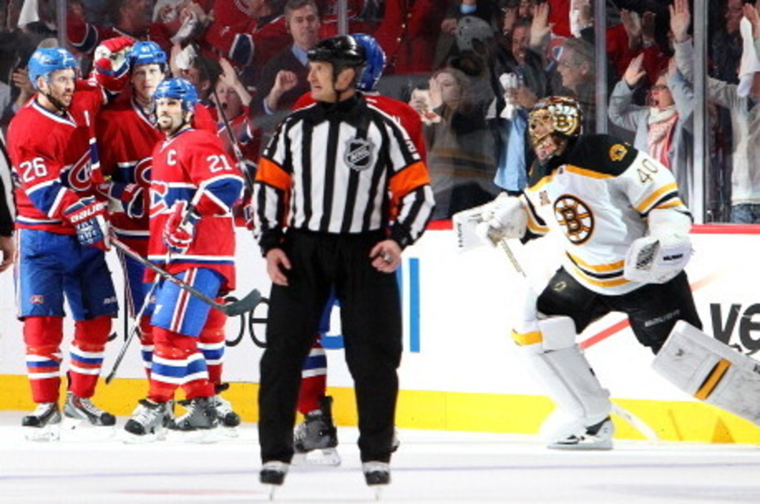 MONTREAL, QC - MAY 6: Lars Eller #81 of the Montreal Canadiens celebrates his third-period, open-net goal with teammates Josh Gorges #26 and Brian Gionta #21 as Tuukka Rask #40 of the Boston Bruins skates out of his bench in Game Three of the Second Round