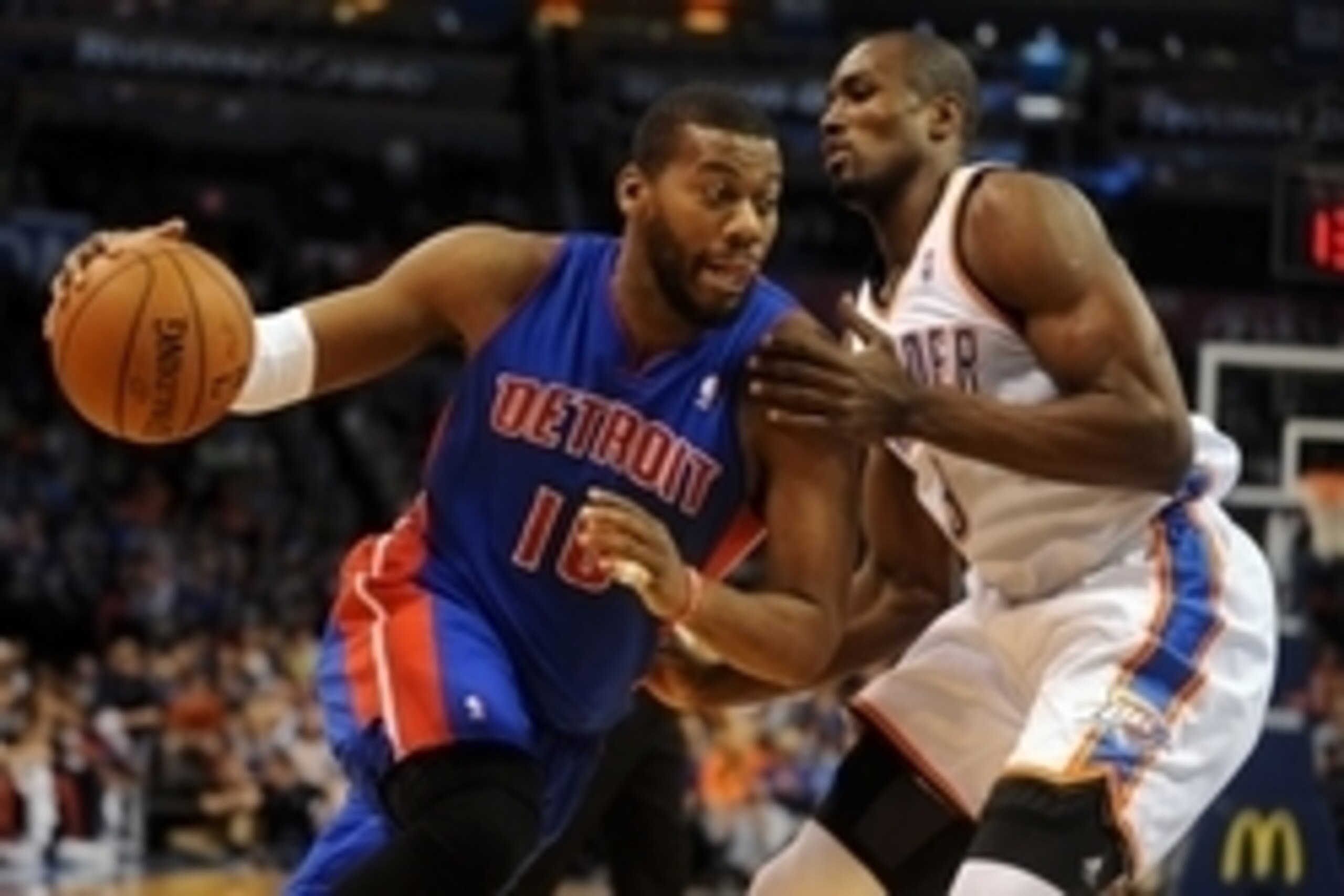Apr 16, 2014; Oklahoma City, OK, USA;  Detroit Pistons forward Greg Monroe (10) drives to the basket against Oklahoma City Thunder forward Serge Ibaka (9) during the first quarter at Chesapeake Energy Arena. Mandatory Credit: Mark D. Smith-USA TODAY Sport