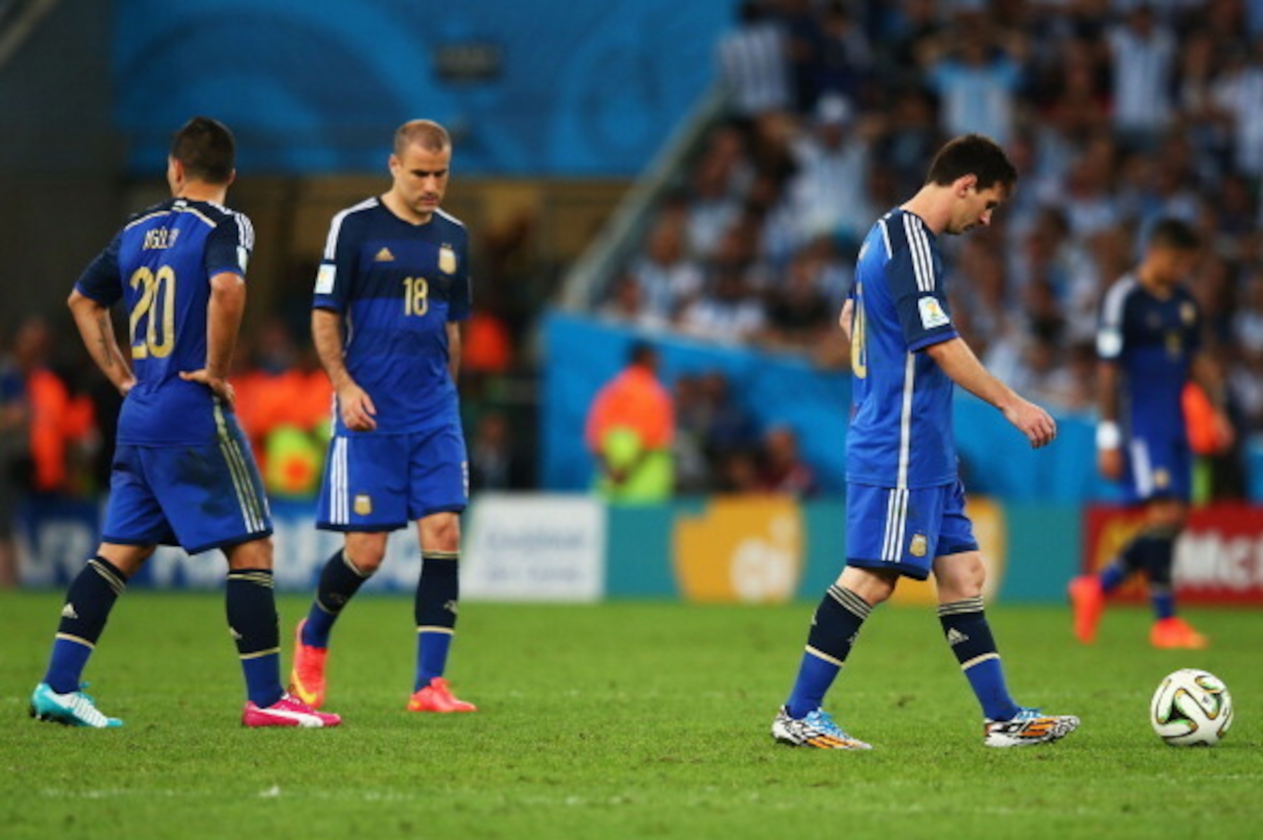 RIO DE JANEIRO, BRAZIL - JULY 13:  Lionel Messi of Argentina (R) looks dejected after a goal during the 2014 FIFA World Cup Brazil Final match between Germany and Argentina at Maracana on July 13, 2014 in Rio de Janeiro, Brazil.  (Photo by Julian Finney/G