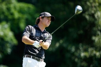 SILVIS, IL - JULY 13:  Brian Harman tees off on the 13th hole during the final round of the John Deere Classic held at TPC Deere Run on July 13, 2014 in Silvis, Illinois.  (Photo by Gregory Shamus/Getty Images)