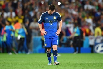 RIO DE JANEIRO, BRAZIL - JULY 13: A dejected Lionel Messi of Argentina reacts after being defeated by Germany 1-0 in extra time during the 2014 FIFA World Cup Brazil Final match between Germany and Argentina at Maracana on July 13, 2014 in Rio de Janeiro,