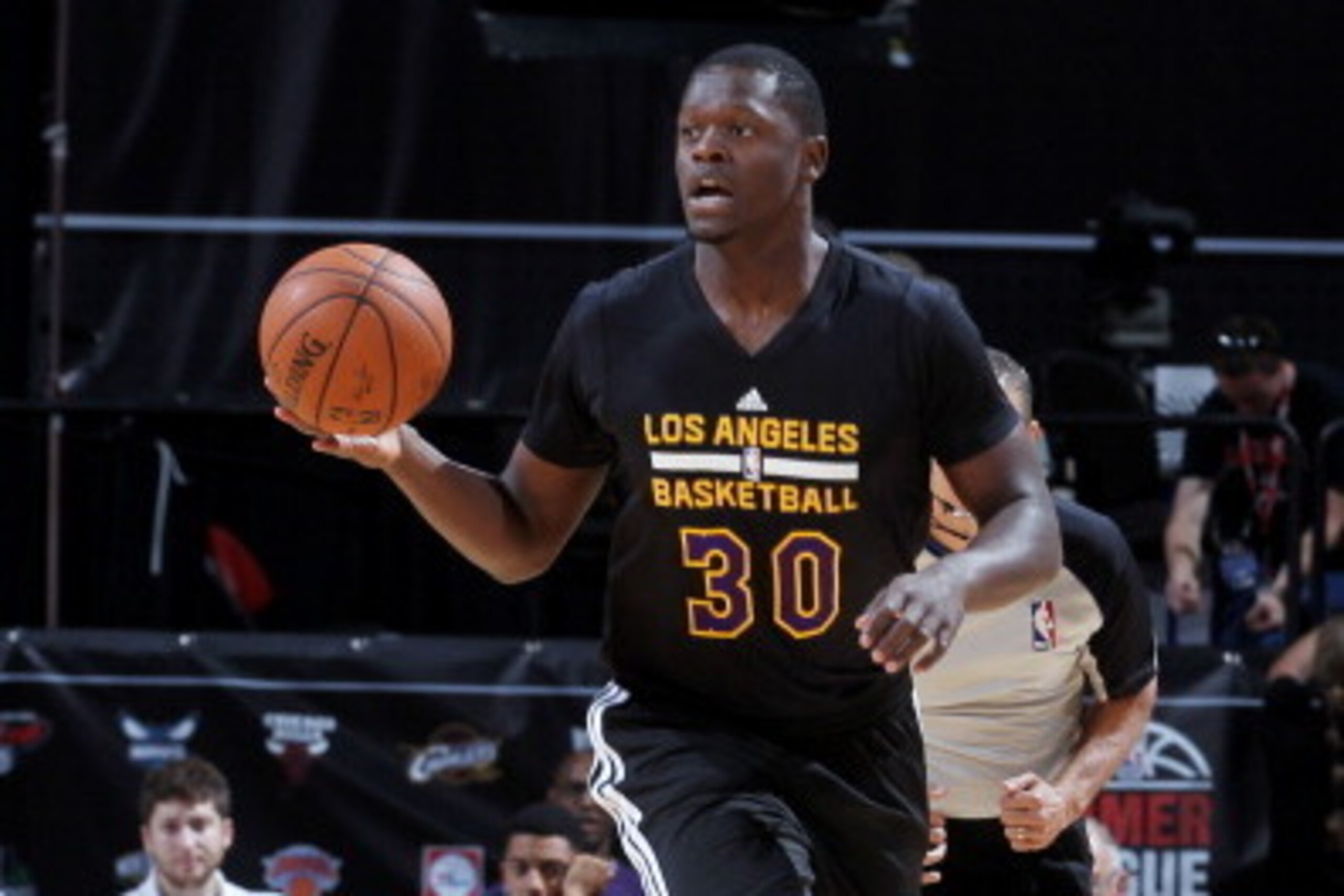 LAS VEGAS, NV - JULY 13: Julius Randle #30 of the Los Angeles Lakers drives against the New Orleans Pelicans on July 13, 2014 at Thomas & Mack  in Las Vegas, Nevada. NOTE TO USER: User expressly acknowledges and agrees that, by downloading and or using th