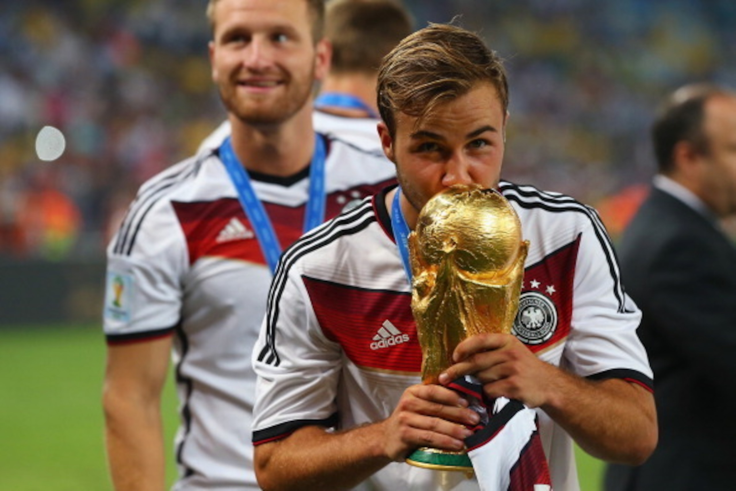 RIO DE JANEIRO, BRAZIL - JULY 13:  Mario Goetze  of Germany kisses the World Cup trophy after defeating Argentina 1-0 in extra time during the 2014 FIFA World Cup Brazil Final match between Germany and Argentina at Maracana on July 13, 2014 in Rio de Jane