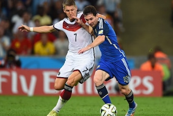 RIO DE JANEIRO, BRAZIL - JULY 13: Bastian Schweinsteiger of Germany challenges Lionel Messi of Argentina during the 2014 FIFA World Cup Brazil Final match between Germany and Argentina at Maracana on July 13, 2014 in Rio de Janeiro, Brazil.  (Photo by Mat