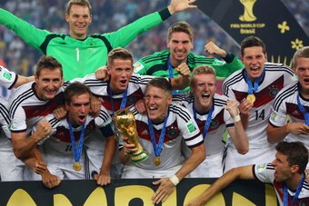 RIO DE JANEIRO, BRAZIL - JULY 13:  (L-R) Miroslav Klose, Philipp Lahm, Manuel Neuer, Erik Durm, Bastian Schweinsteiger, Ron-Robert Zieler, Toni Kroos, Julian Draxler and Thomas Mueller of Germany   celebrate with the World Cup trophy after defeating Argen
