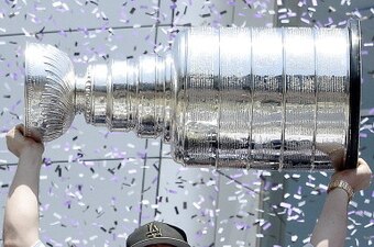 LOS ANGELES CA-JUNE 16: Jonathan Quick #32 of the Los Angeles Kings holds up the Stanley Cup during Los Angeles Kings victory parade and rally June 16, 2014, in Los Angeles, California. (Photo by Kevork Djansezian/Getty Images)
