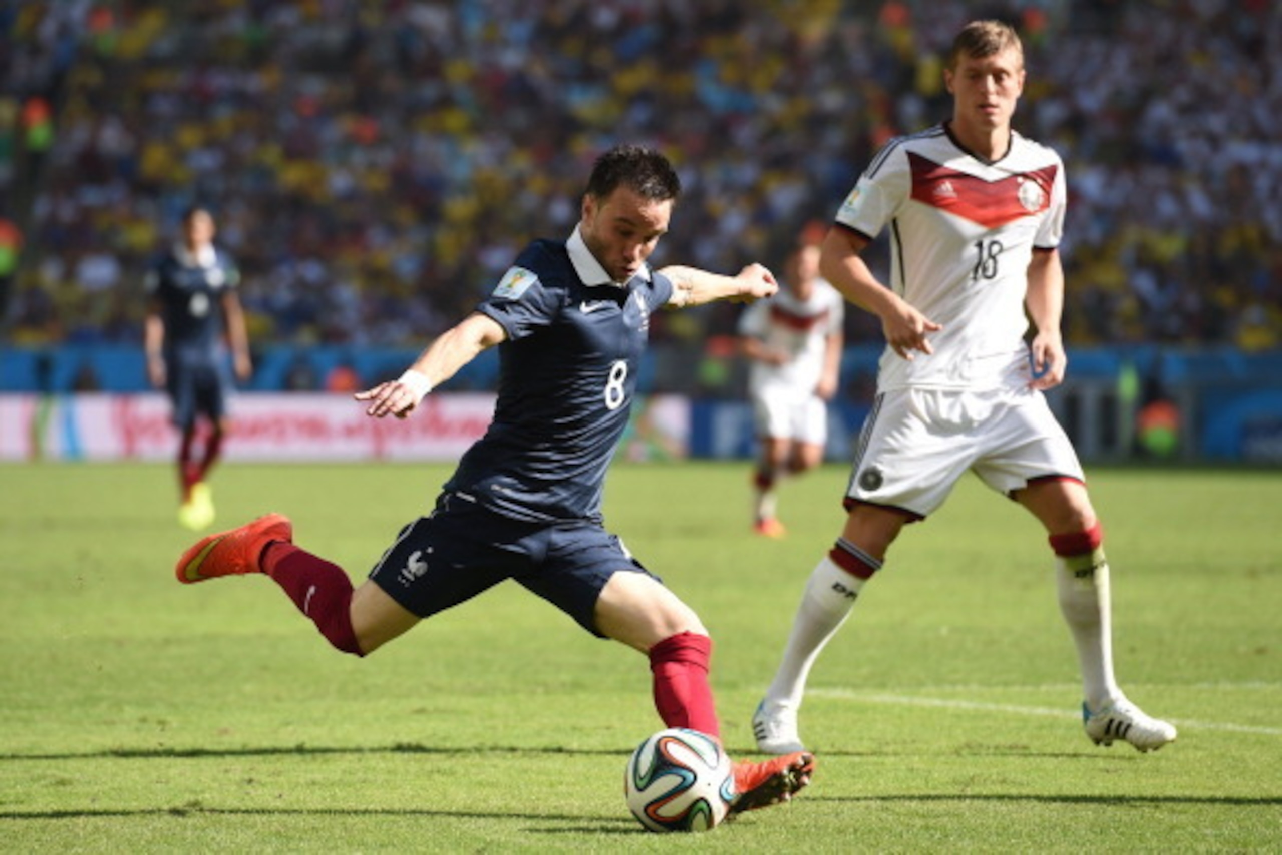 RIO DE JANEIRO, BRAZIL - JULY 04: Mathieu Valbuena of France strikes the ball against Toni Kroos of Germany during the 2014 FIFA World Cup Brazil Quarter Final match between France and Germany at Maracana on July 4, 2014 in Rio de Janeiro, Brazil.  (Photo