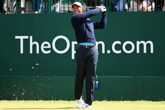HOYLAKE, ENGLAND - JULY 13:  Tiger Woods of the USA tees off on the 1st hole during a practice round ahead of the 143rd Open Championship at Royal Liverpool on July 13, 2014 in Hoylake, England.  (Photo by Matthew Lewis/Getty Images)