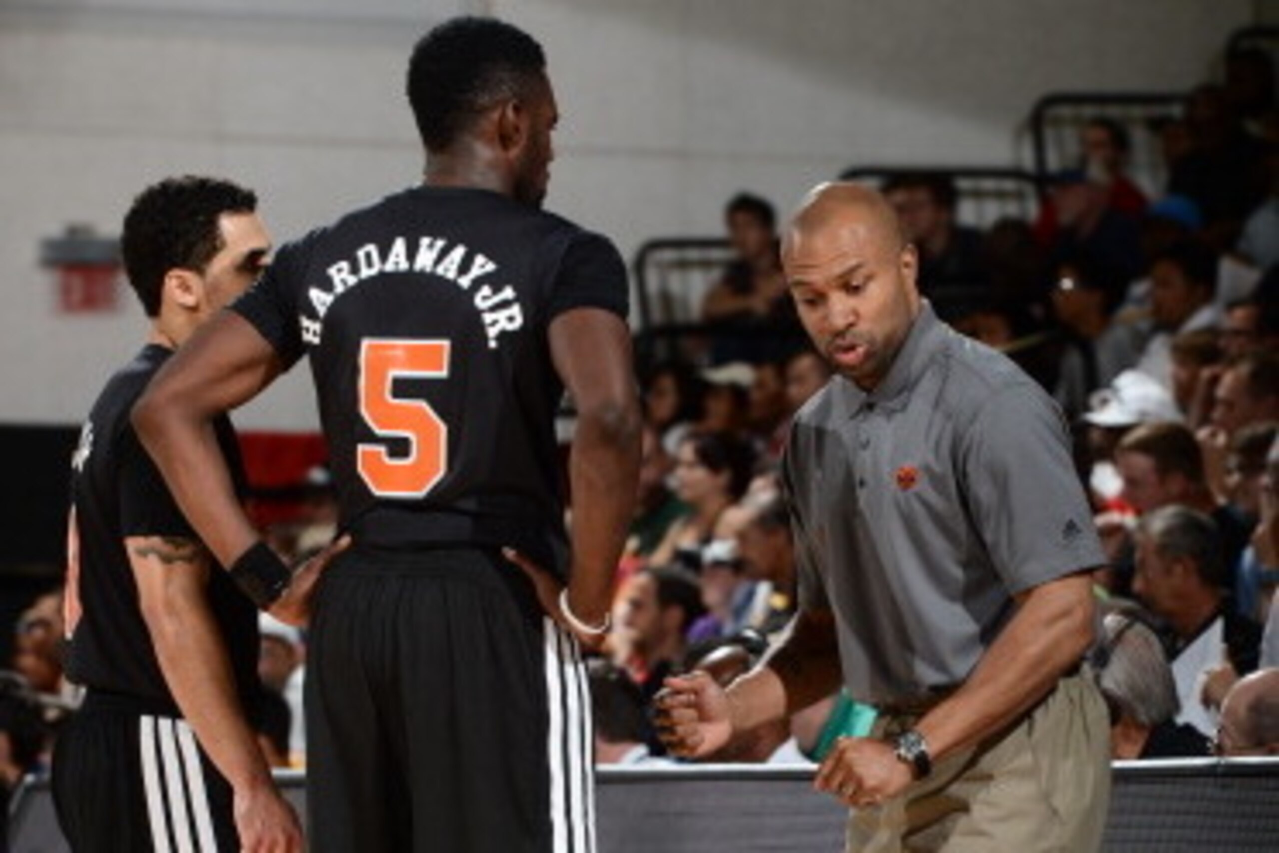 LAS VEGAS, NV - JULY 11: Head coach Derek Fisher of the New York Knicks speaks with Shane Larkin #0 and Tim Hardaway Jr. #5 against the Dallas Mavericks during the game on July 11, 2014 at Cox Pavilion in Las Vegas, Nevada. NOTE TO USER: User expressly ac