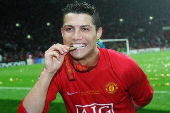 MOSCOW - MAY 21:  Cristiano Ronaldo of Manchester United bites his winners medal following his team's victory during the UEFA Champions League Final match between Manchester United and Chelsea at the Luzhniki Stadium on May 21, 2008 in Moscow, Russia.  (P