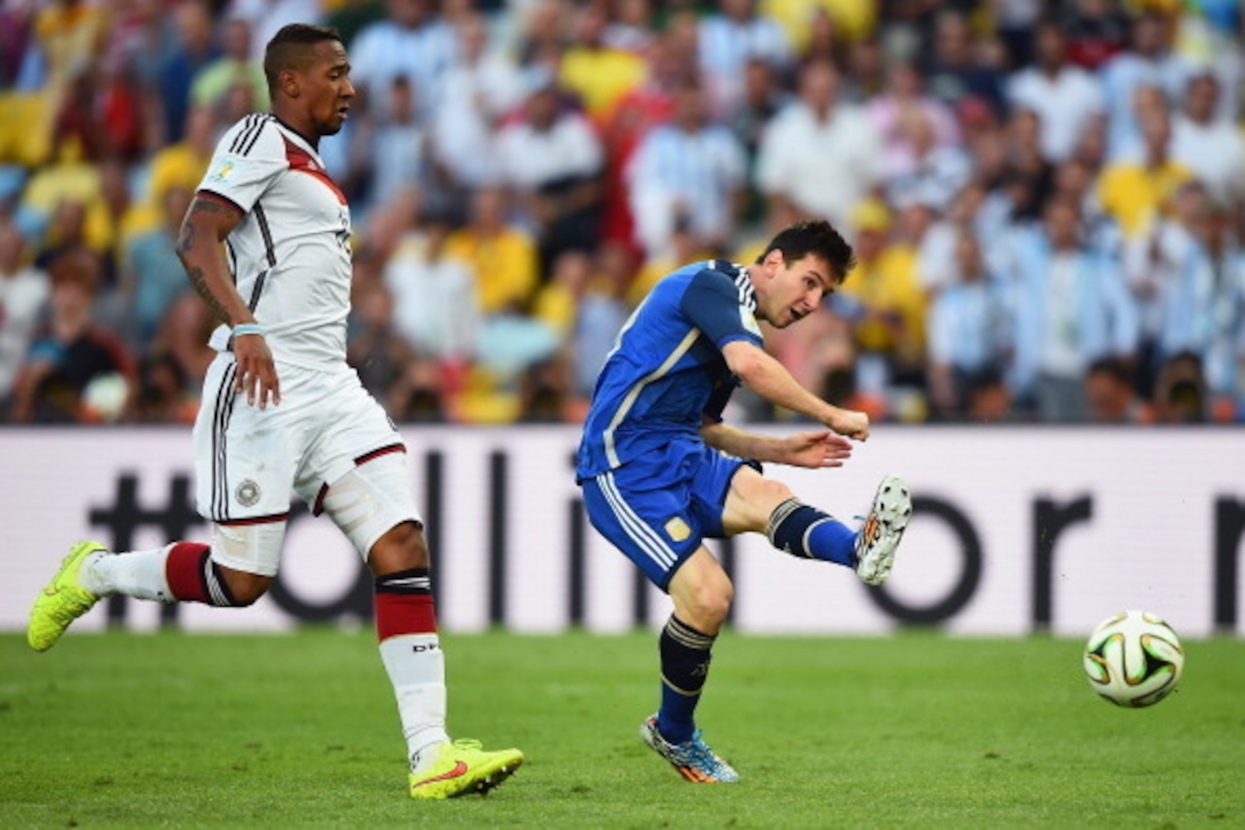 RIO DE JANEIRO, BRAZIL - JULY 13:  Lionel Messi of Argentina attempts a shot at goal as Jerome Boateng  of Germany gives chase during the 2014 FIFA World Cup Brazil Final match between Germany and Argentina at Maracana on July 13, 2014 in Rio de Janeiro, 