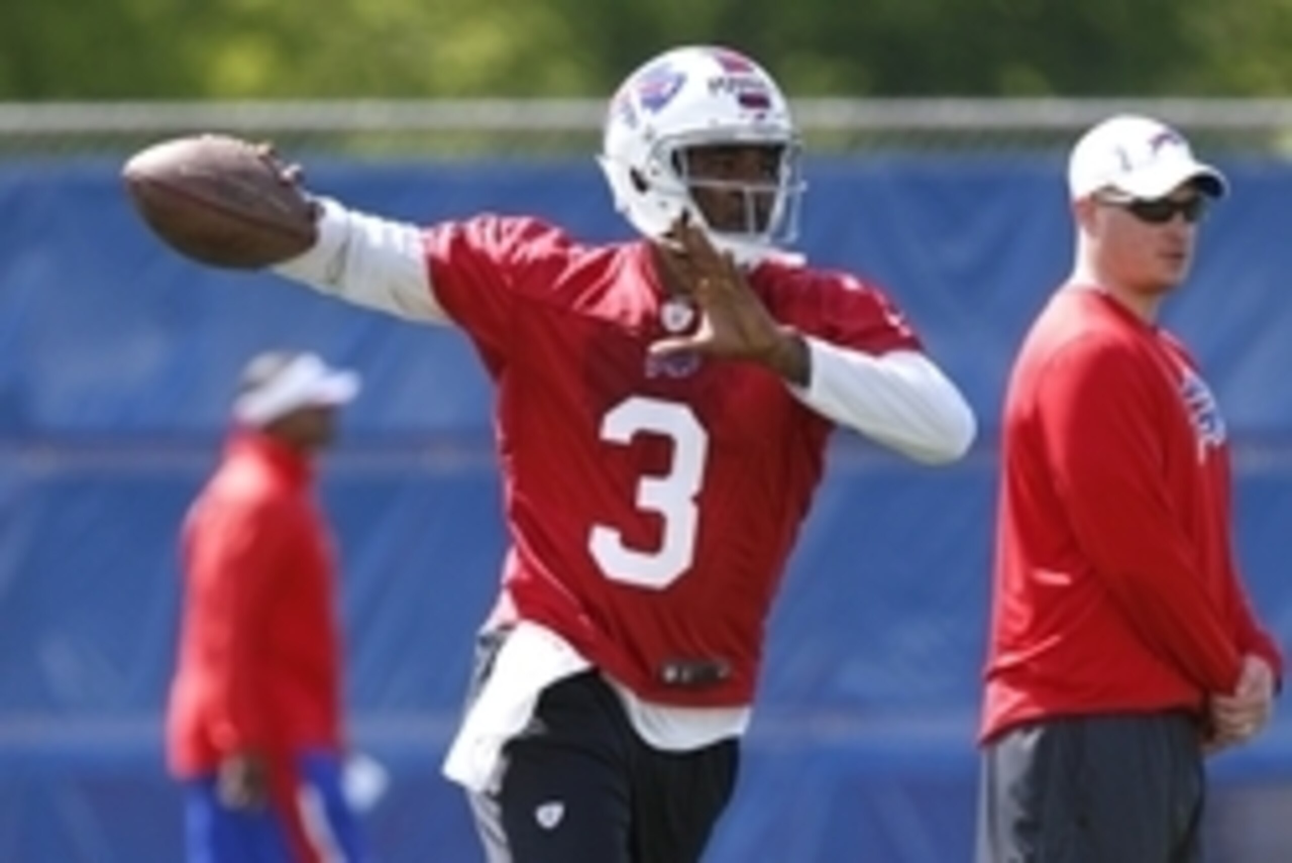 May 28, 2014; Buffalo, NY, USA; Buffalo Bills quarterback EJ Manuel (3) rolls out to pass as Bills offensive coordinator Nathaniel Hackett looks on during organized team activities at Ralph Wilson Stadium. Mandatory Credit: Kevin Hoffman-USA TODAY Sports