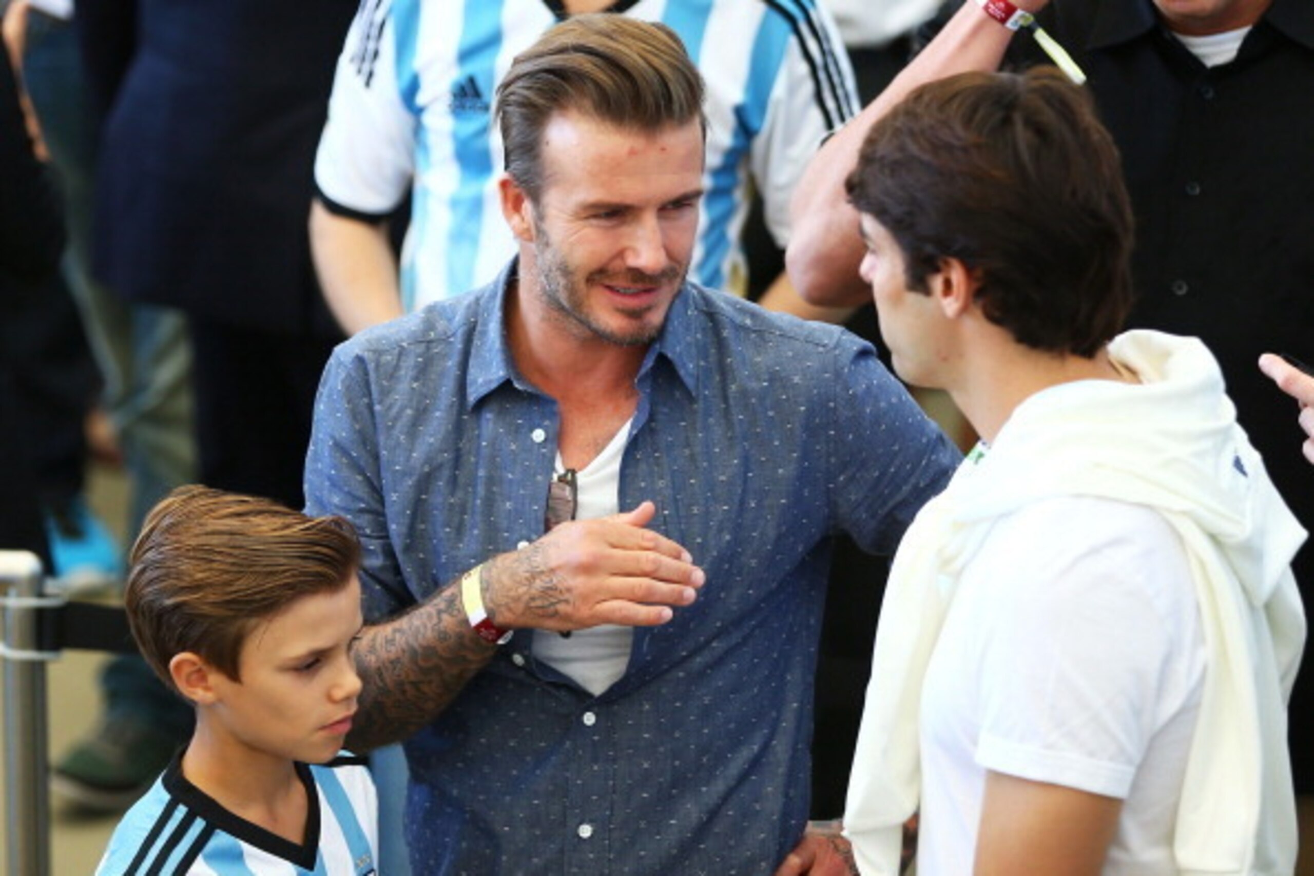 RIO DE JANEIRO, BRAZIL - JULY 13:  Former England international David Beckham and son Romeo Beckham attend the 2014 FIFA World Cup Brazil Final match between Germany and Argentina at Maracana on July 13, 2014 in Rio de Janeiro, Brazil.  (Photo by Michael 