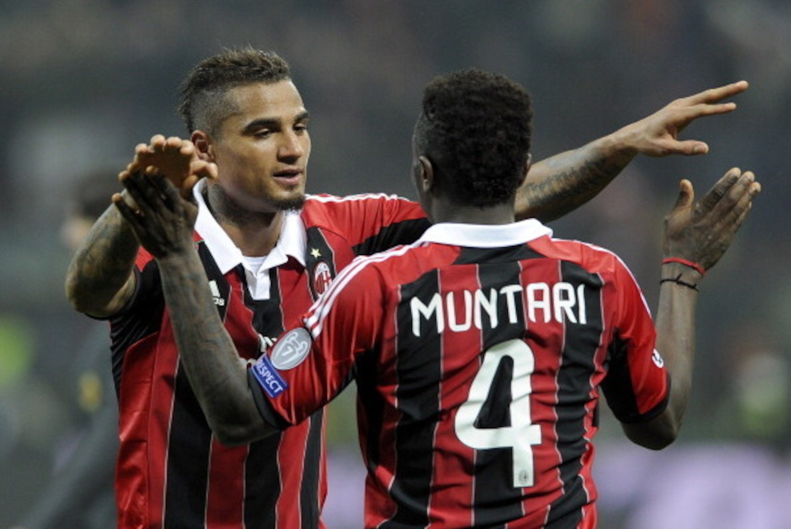 MILAN, ITALY - FEBRUARY 20:  Kevin Prince Boateng and Sulley Muntari of AC Milan celebrate victory at the end of the UEFA Champions League Round of 16 first leg match between AC Milan and Barcelona at San Siro Stadium on February 20, 2013 in Milan, Italy.