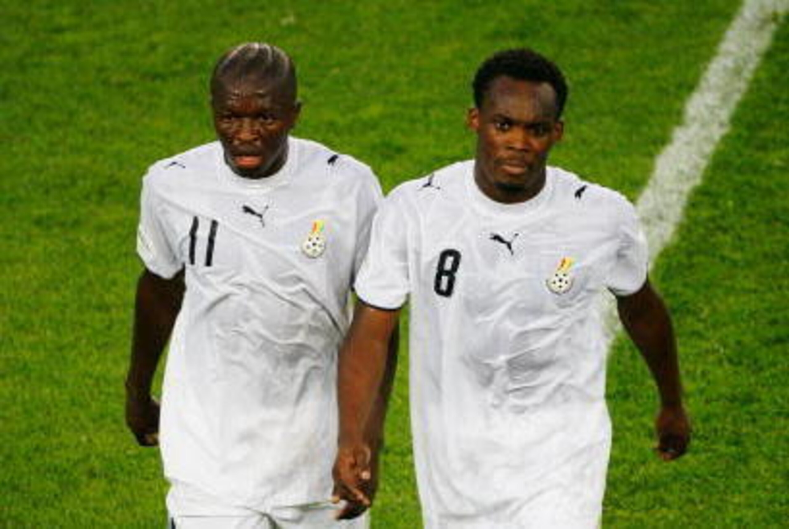 HANOVER, GERMANY - JUNE 12: Sulley Muntari (L) and Michael Essien of Ghana walk from the pitch at half time during the FIFA World Cup Germany 2006 Group E match between Italy and Ghana played at the Stadium Hanover on June 12, 2006 in Hanover, Germany. (P