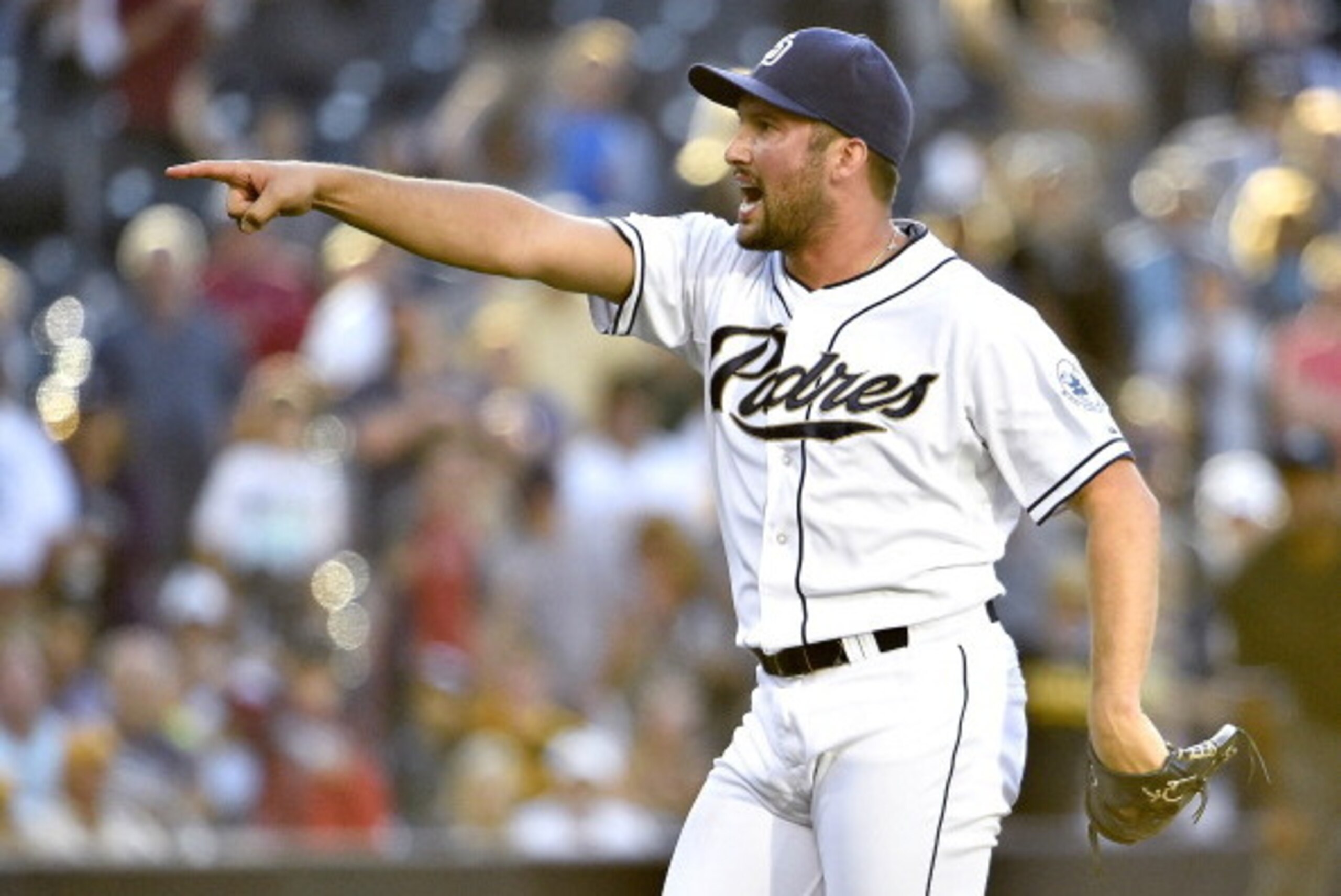 SAN DIEGO, CA - JUNE 4:  Huston Street #16 of the San Diego Padres points after striking out Russell Martin #55 of the Pittsburgh Pirates for the final out during the ninth inning of a baseball game at Petco Park June 4, 2014 in San Diego, California.  (P