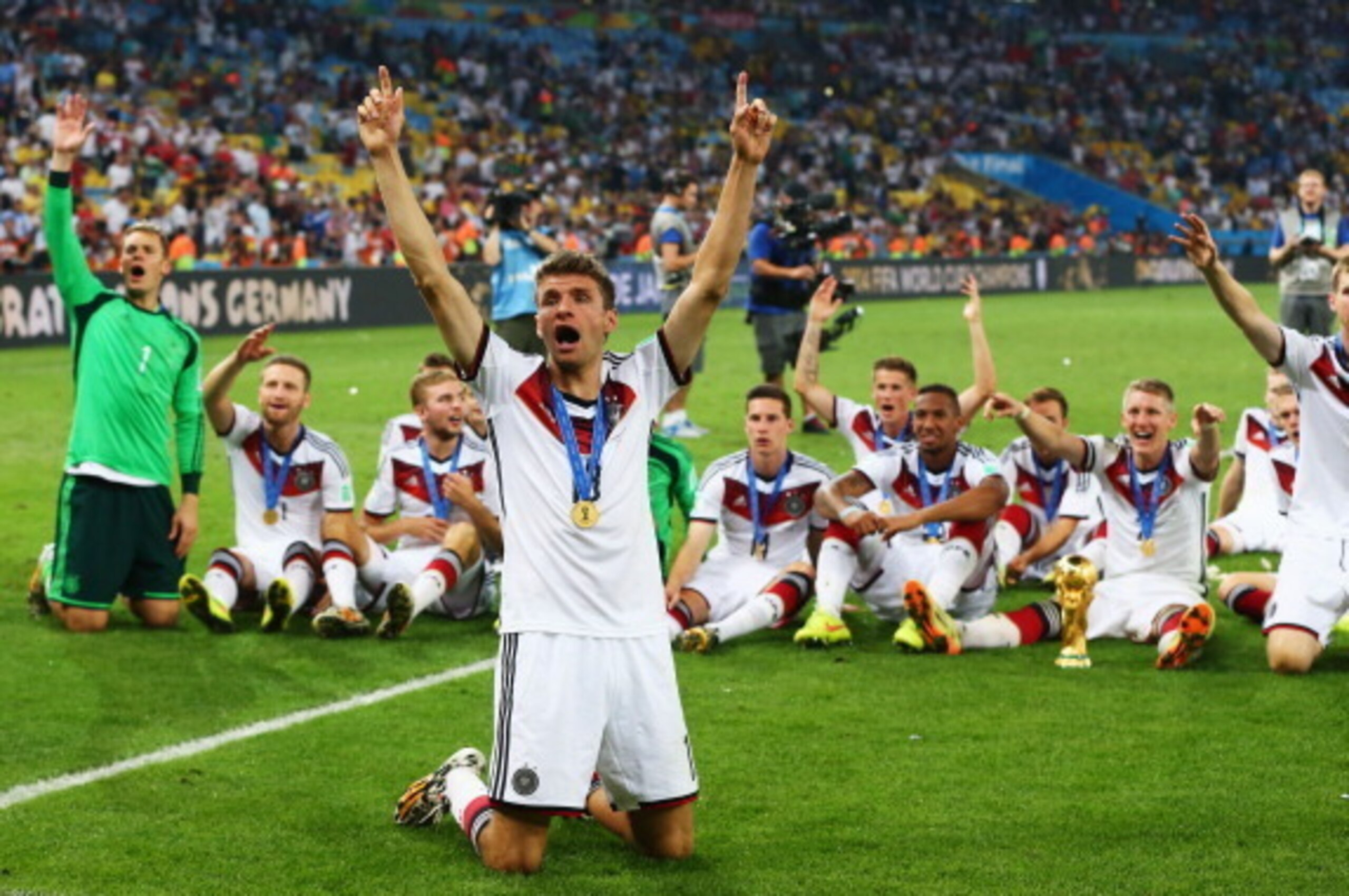 RIO DE JANEIRO, BRAZIL - JULY 13:  Thomas Mueller  of Germany celebrates with teammates after defeating Argentina 1-0 in extra time during the 2014 FIFA World Cup Brazil Final match between Germany and Argentina at Maracana on July 13, 2014 in Rio de Jane