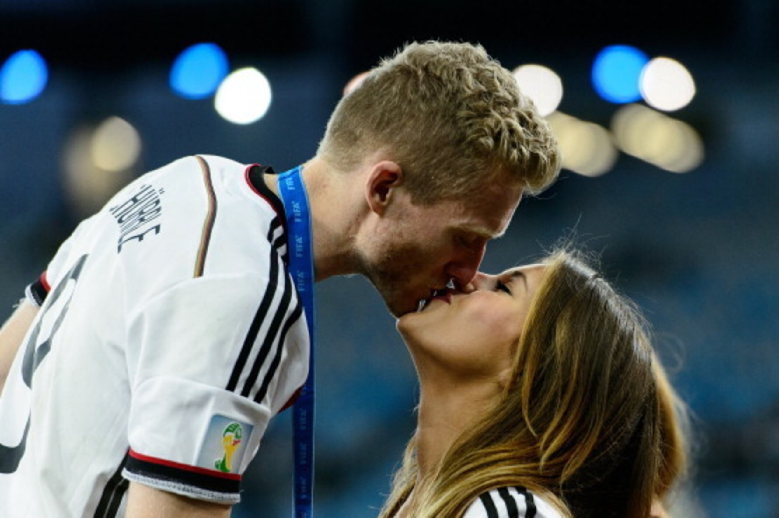 RIO DE JANEIRO, BRAZIL - JULY 13:  Andre Schuerrle of Germany celebrates with girlfriend Montana Yorke after defeating Argentina 1-0 in extra time during the 2014 FIFA World Cup Brazil Final match between Germany and Argentina at Maracana on July 13, 2014