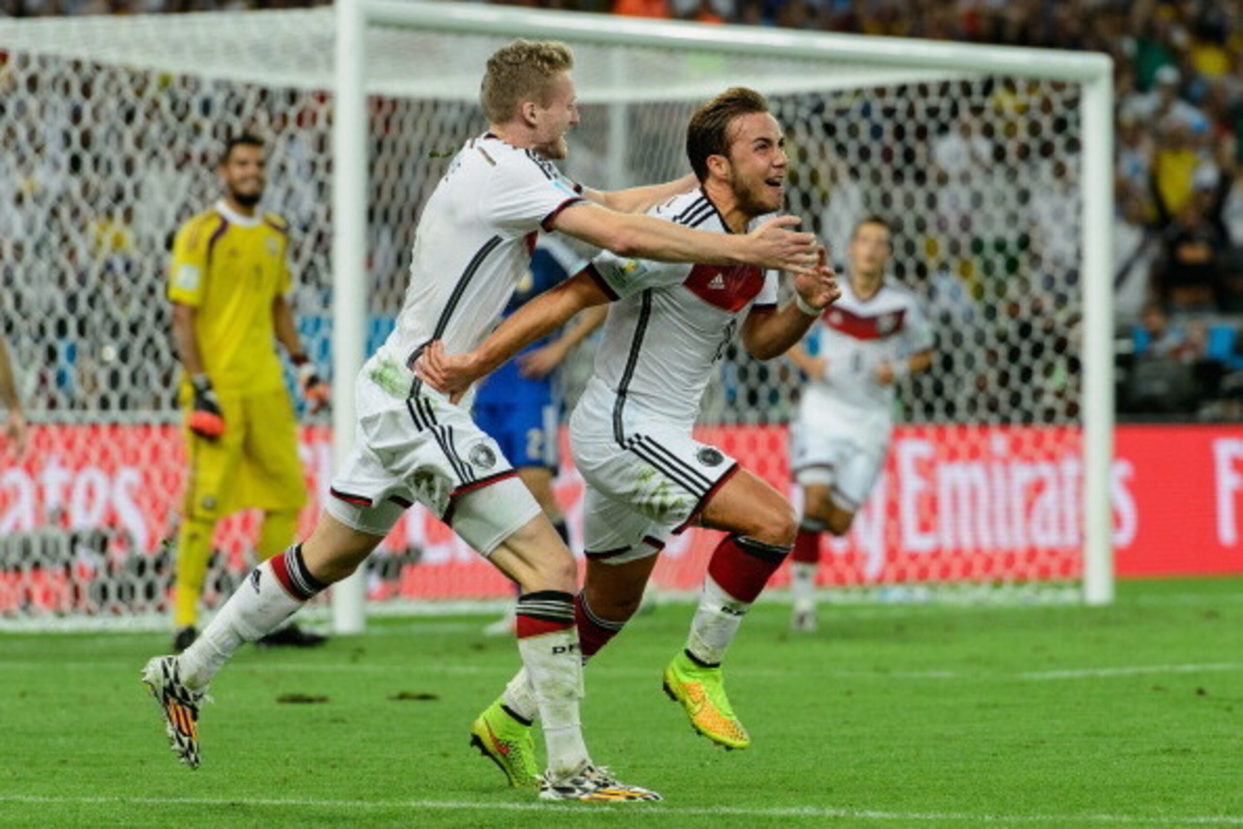RIO DE JANEIRO, BRAZIL - JULY 13:  Mario Goetze (R) of Germany celebrates scoring his team's first goal with Andre Schuerrle during the 2014 FIFA World Cup Brazil Final match between Germany and Argentina at Maracana on July 13, 2014 in Rio de Janeiro, Br