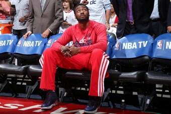 WASHINGTON, DC - MAY 15:  John Wall #2 of the Washington Wizards sits on the bench before the game against the Indiana Pacers in Game Six of the Eastern Conference Semifinals during the 2014 NBA Playoffs at the Verizon Center on May 15, 2014 in Washington