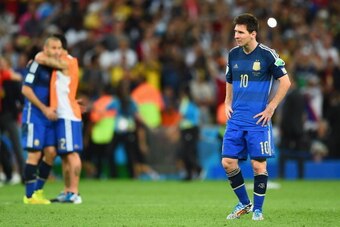 RIO DE JANEIRO, BRAZIL - JULY 13: A dejected Lionel Messi of Argentina looks on after being defeated by Germany 1-0 in extra time during the 2014 FIFA World Cup Brazil Final match between Germany and Argentina at Maracana on July 13, 2014 in Rio de Janeir