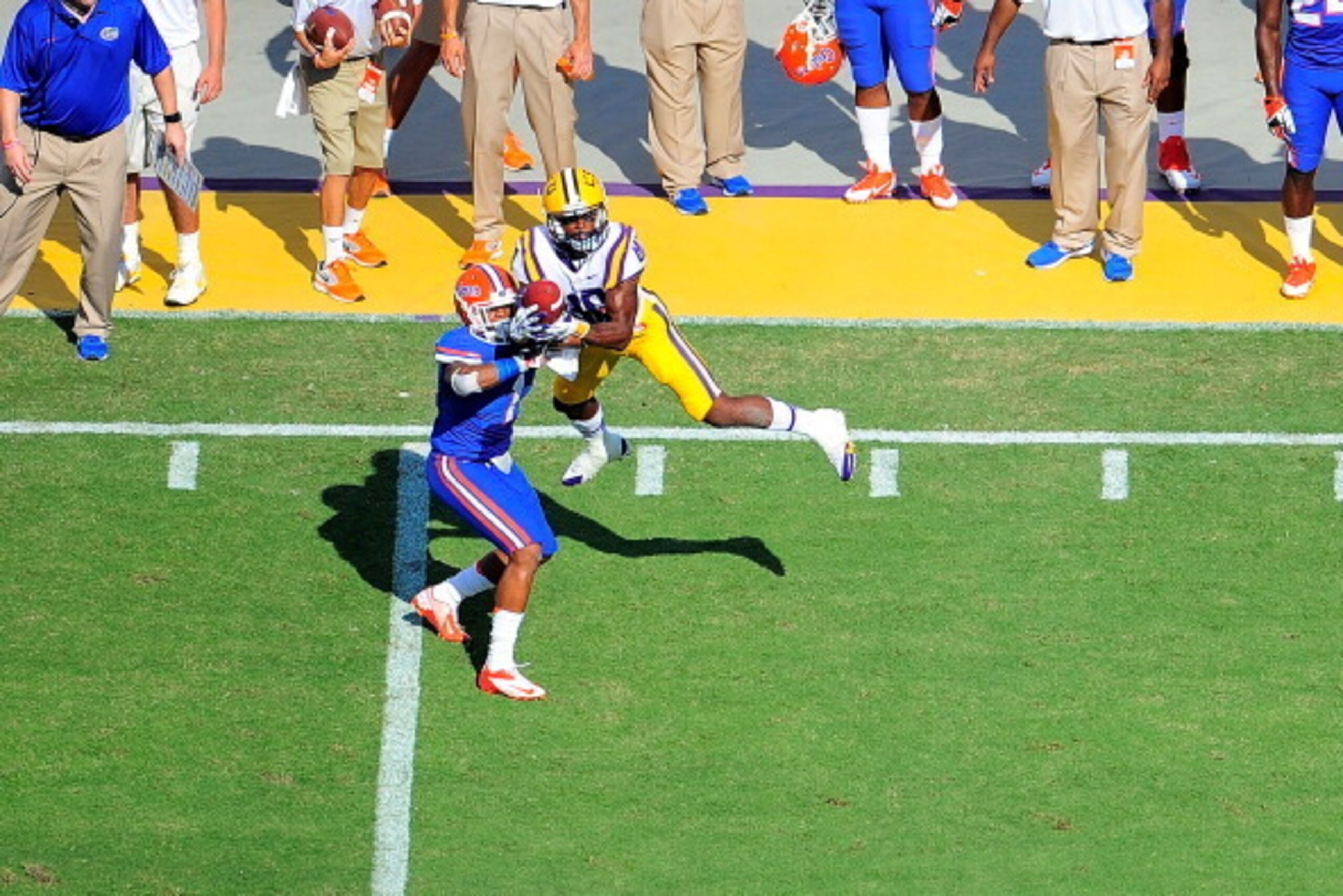 BATON ROUGE, LA - OCTOBER 12:  Jarvis Landry #80 of the LSU Tigers catches a pass in front of Vernon Hargreaves III #1 of the Florida Gators during a game at Tiger Stadium on October 12, 2013 in Baton Rouge, Louisiana.  (Photo by Stacy Revere/Getty Images
