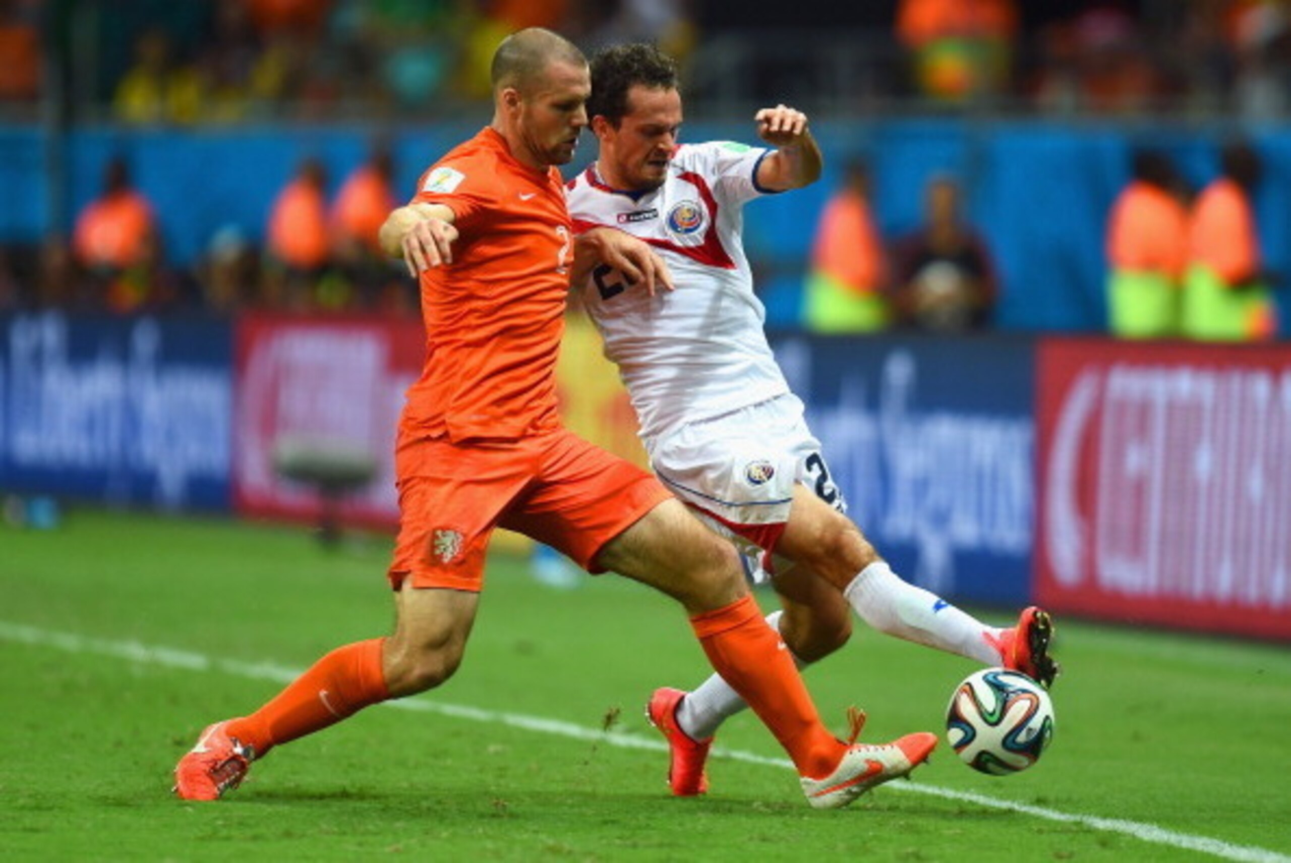 SALVADOR, BRAZIL - JULY 05:  Ron Vlaar of the Netherlands and Johnny Acosta of Costa Rica compete for the ball during the 2014 FIFA World Cup Brazil Quarter Final match between the Netherlands and Costa Rica at Arena Fonte Nova on July 5, 2014 in Salvador