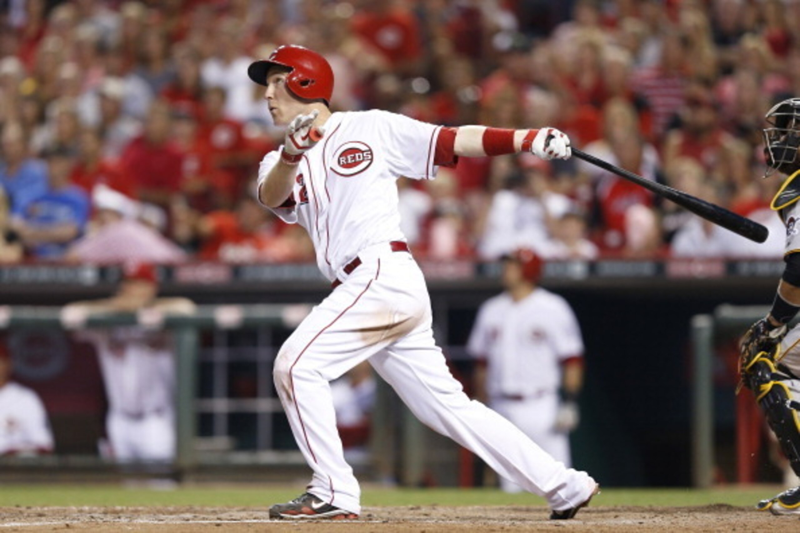 CINCINNATI, OH - JULY 12: Todd Frazier #21 of the Cincinnati Reds hits a three-run home run in the sixth inning of the game against the Pittsburgh Pirates at Great American Ball Park on July 12, 2014 in Cincinnati, Ohio. The Pirates won 6-5 in 11 innings.