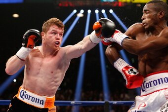 LAS VEGAS, NV - JULY 12:  (L-R) Canelo Alvarez lands a left to the head of Erislandy Lara during their junior middleweight bout at the MGM Grand Garden Arena on July 12, 2014 in Las Vegas, Nevada.  Alvarez defeated Lara by split decision.  (Photo by Josh 