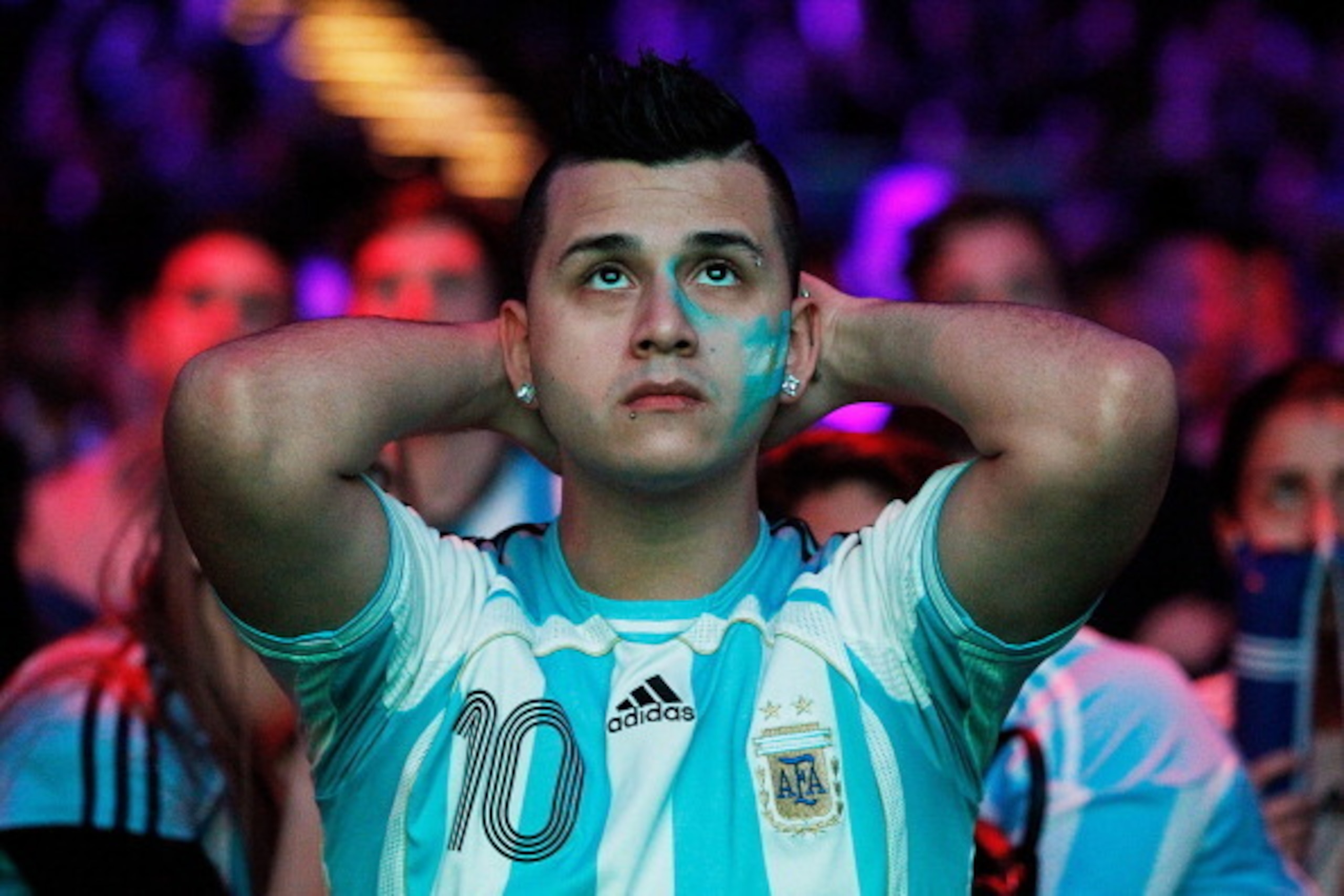 SYDNEY, AUSTRALIA - JULY 14:  An Argentina fan shows his dejection at full time at The Star during the 2014 FIFA World Cup Final match between Germany and Argentina on July 14, 2014 in Sydney, Australia.  (Photo by Brendon Thorne/Getty Images)