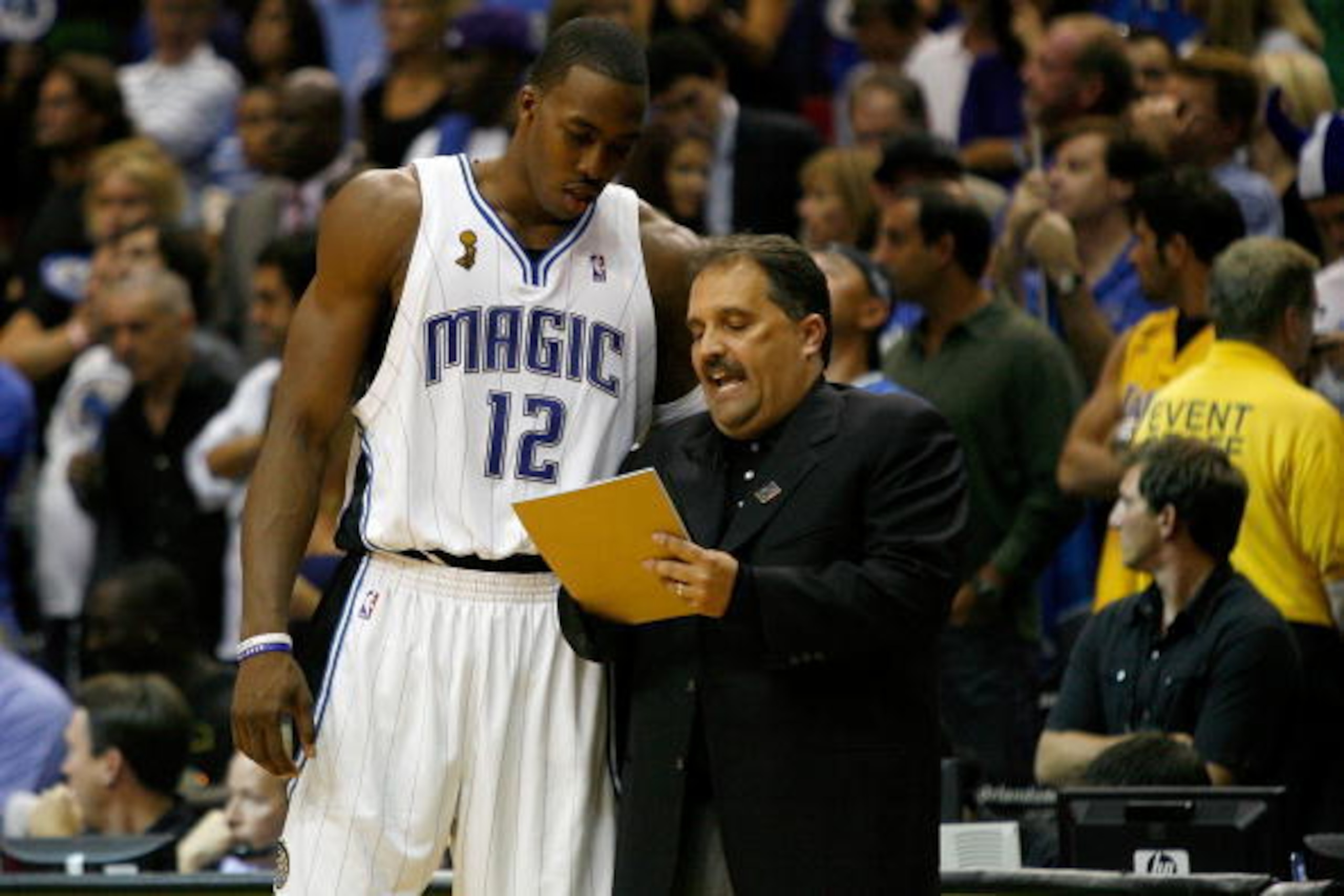 ORLANDO, FL - JUNE 11:  Dwight Howard #12 listens to head coach Stan Van Gundy of the Orlando Magic in Game Four of the 2009 NBA Finals against the Los Angeles Lakers on June 11, 2009 at Amway Arena in Orlando, Florida.  NOTE TO USER:  User expressly ackn