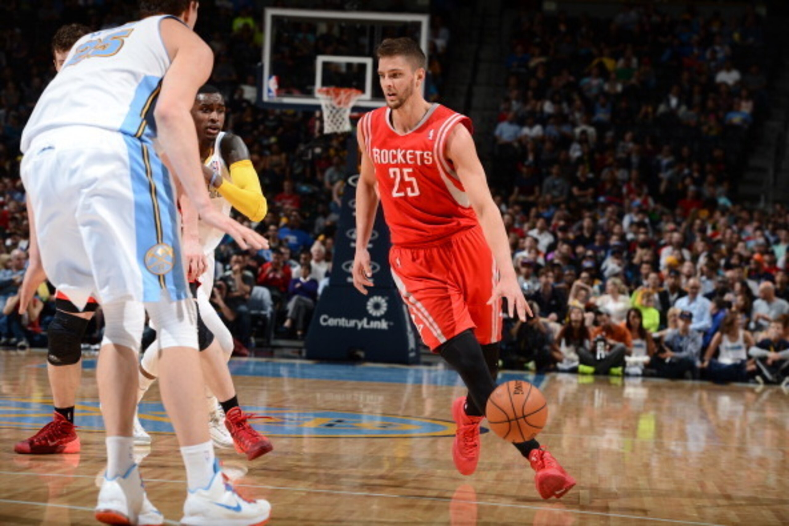 DENVER, CO - APRIL 9: Chandler Parsons #25 of the Houston Rockets drives against the Denver Nuggets on April 9, 2014 at the Pepsi Center in Denver, Colorado. NOTE TO USER: User expressly acknowledges and agrees that, by downloading and/or using this Photo
